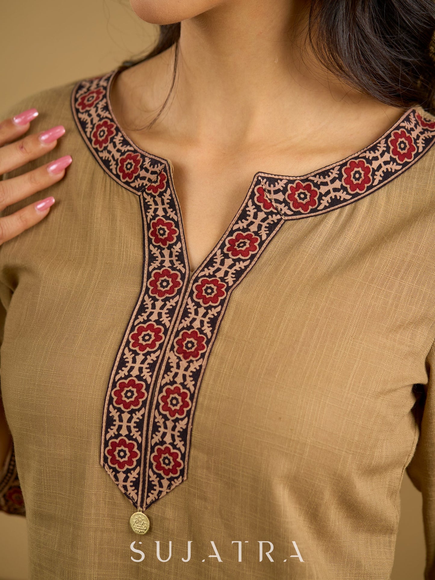 Ethnic dark beige cotton top highlighted with elegant ajrakh detail.