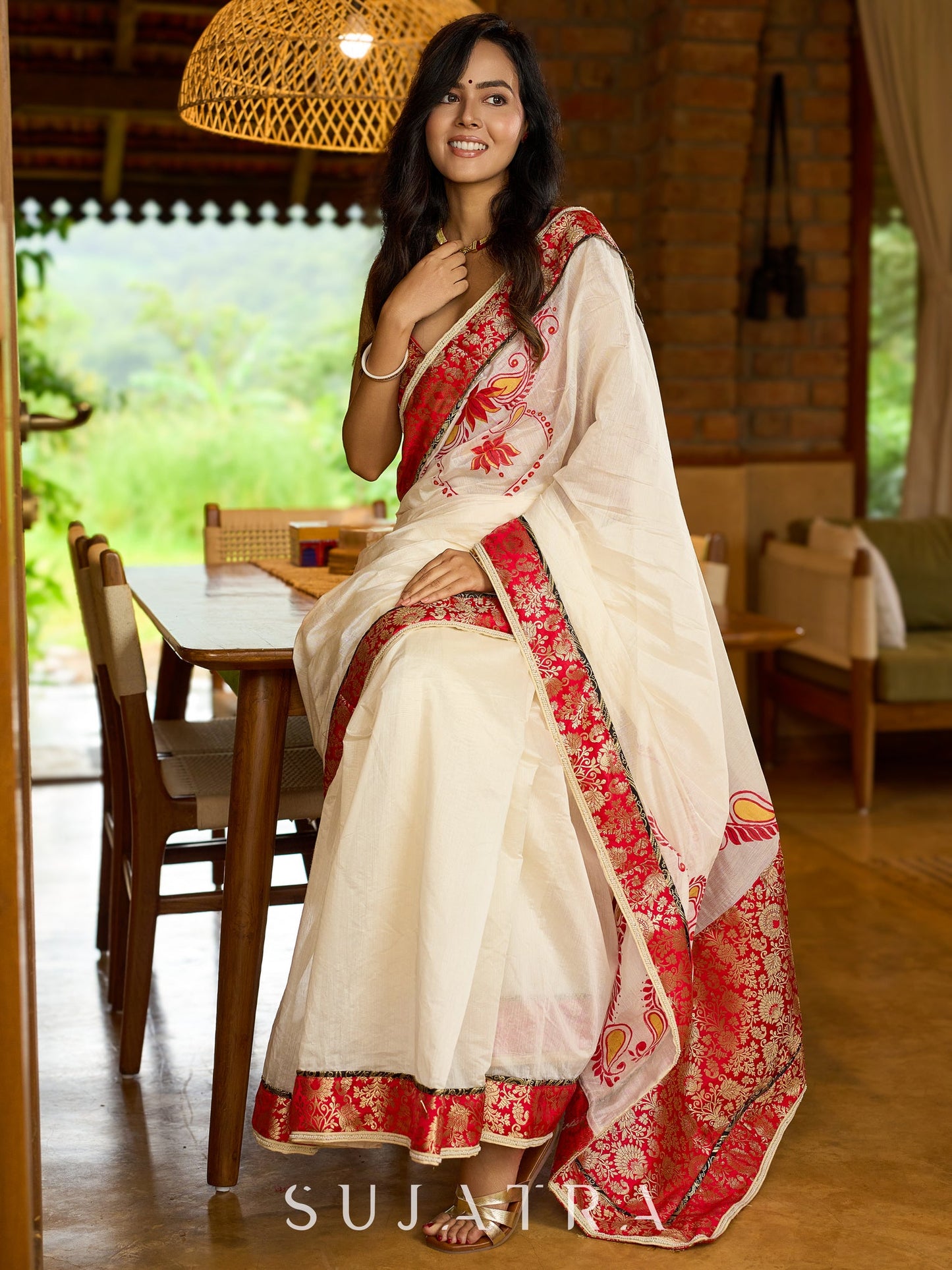 Heritage white Chanderi saree with benarasi border featuring artisanal hand-painted floral motifs