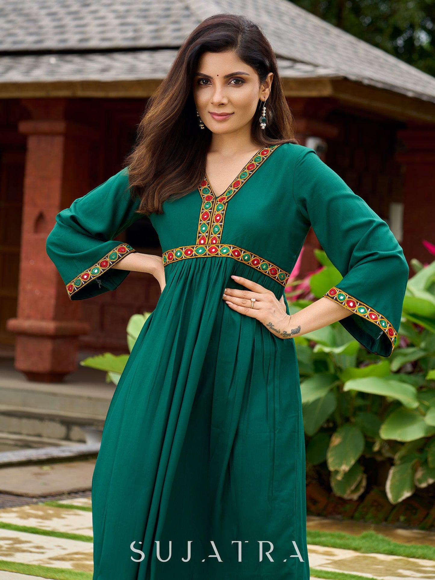 Beautiful Kutch mirror embroidery enriches this flared green rayon kurta - pant optional