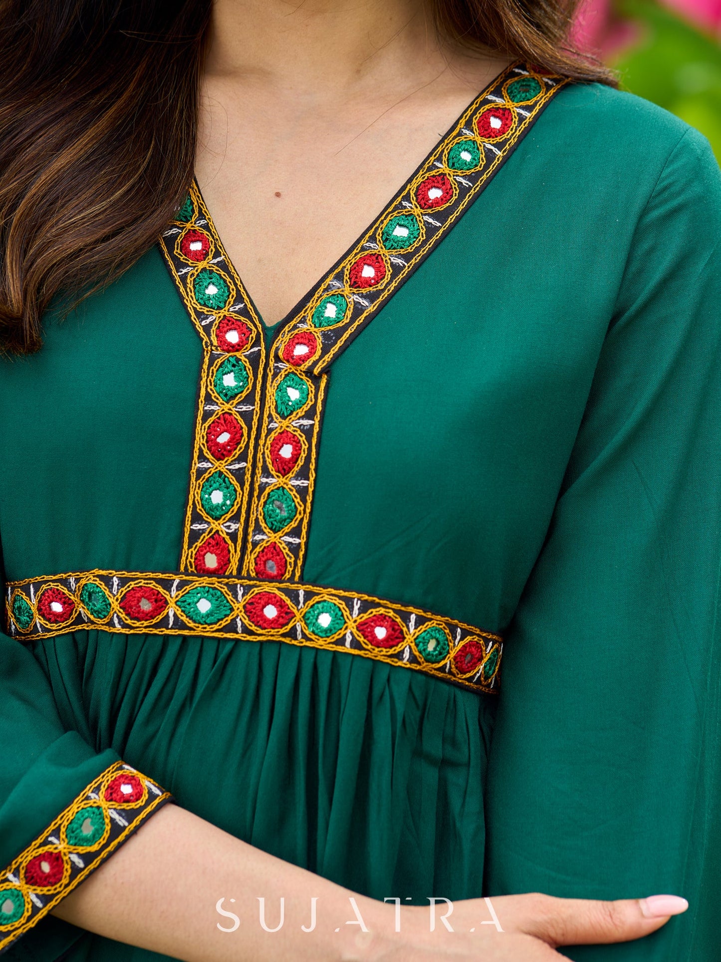 Beautiful Kutch mirror embroidery enriches this flared green rayon kurta - pant optional
