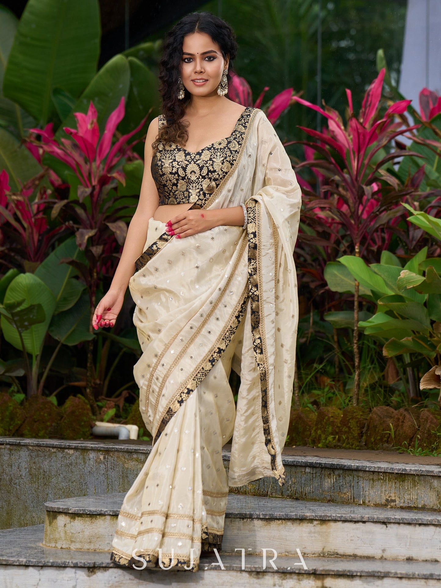 Timeless ivory tissue saree featuring zari embroidery and Banarasi accents
