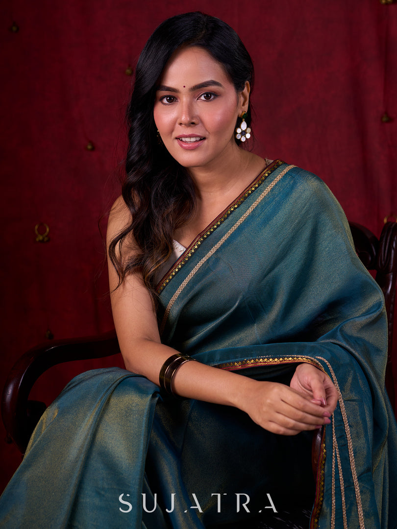 Teal Blue Tissue Saree with Zari Border & Minimal Detailing
