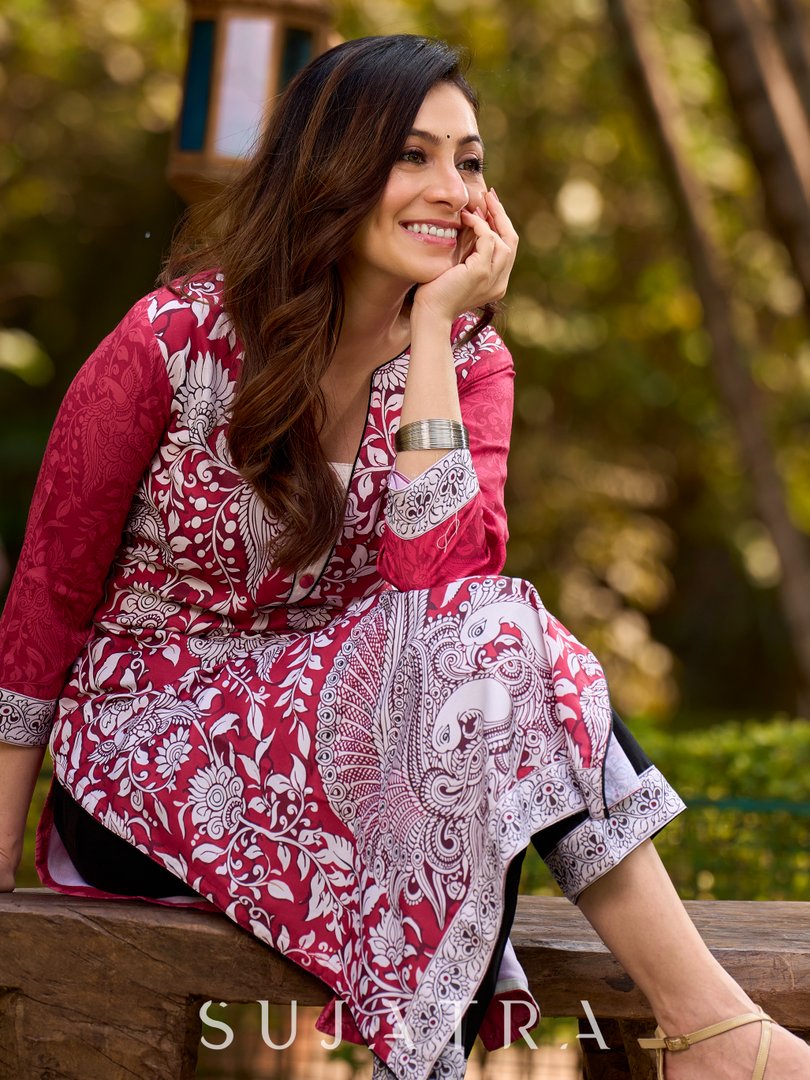 Rich mulberry pink kurta showcasing all-over Kalamkari print with balanced white and black accents