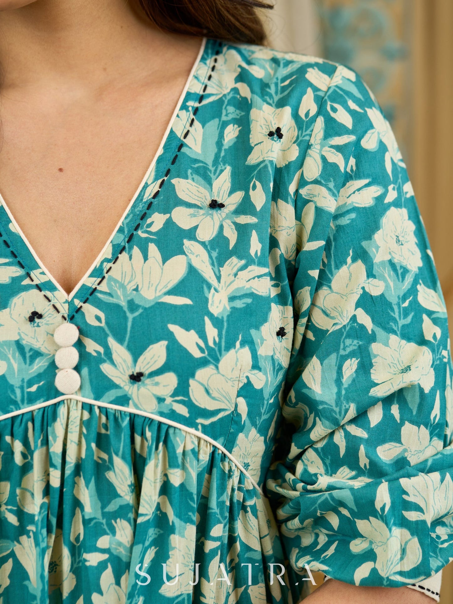 Artful Teal Floral Peplum Dress with Gathered Silhouette, Off-White Piping, and Intricate Black Kantha and French Knot Accents