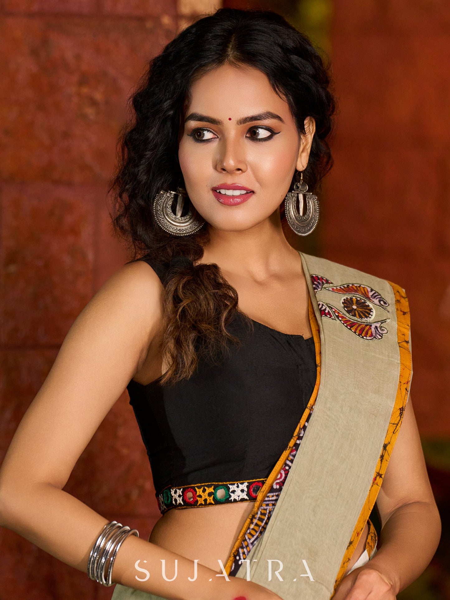 Classic olive Chanderi saree enhanced with heritage batik appliqué