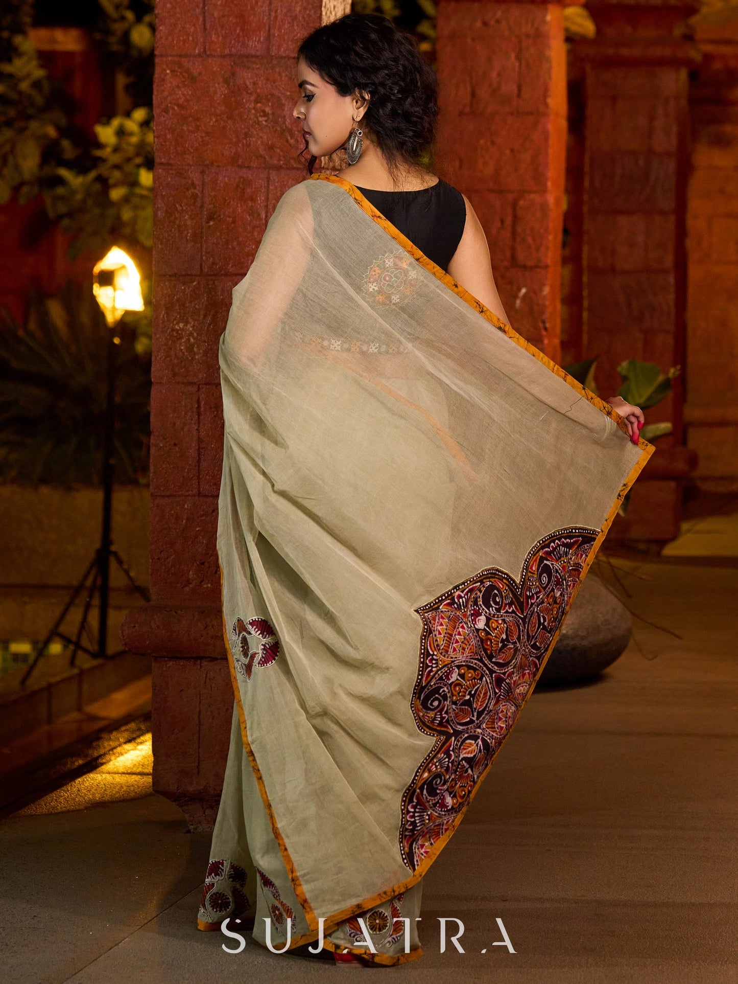 Classic olive Chanderi saree enhanced with heritage batik appliqué