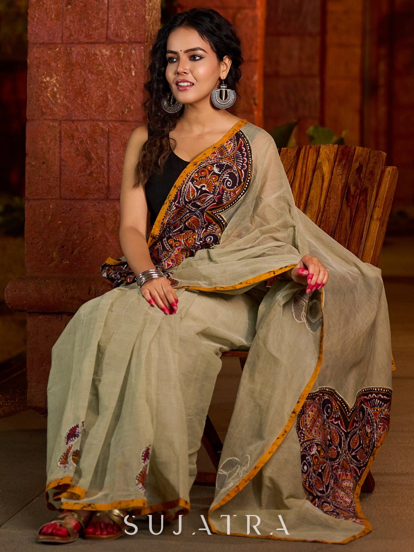 Classic olive Chanderi saree enhanced with heritage batik appliqué