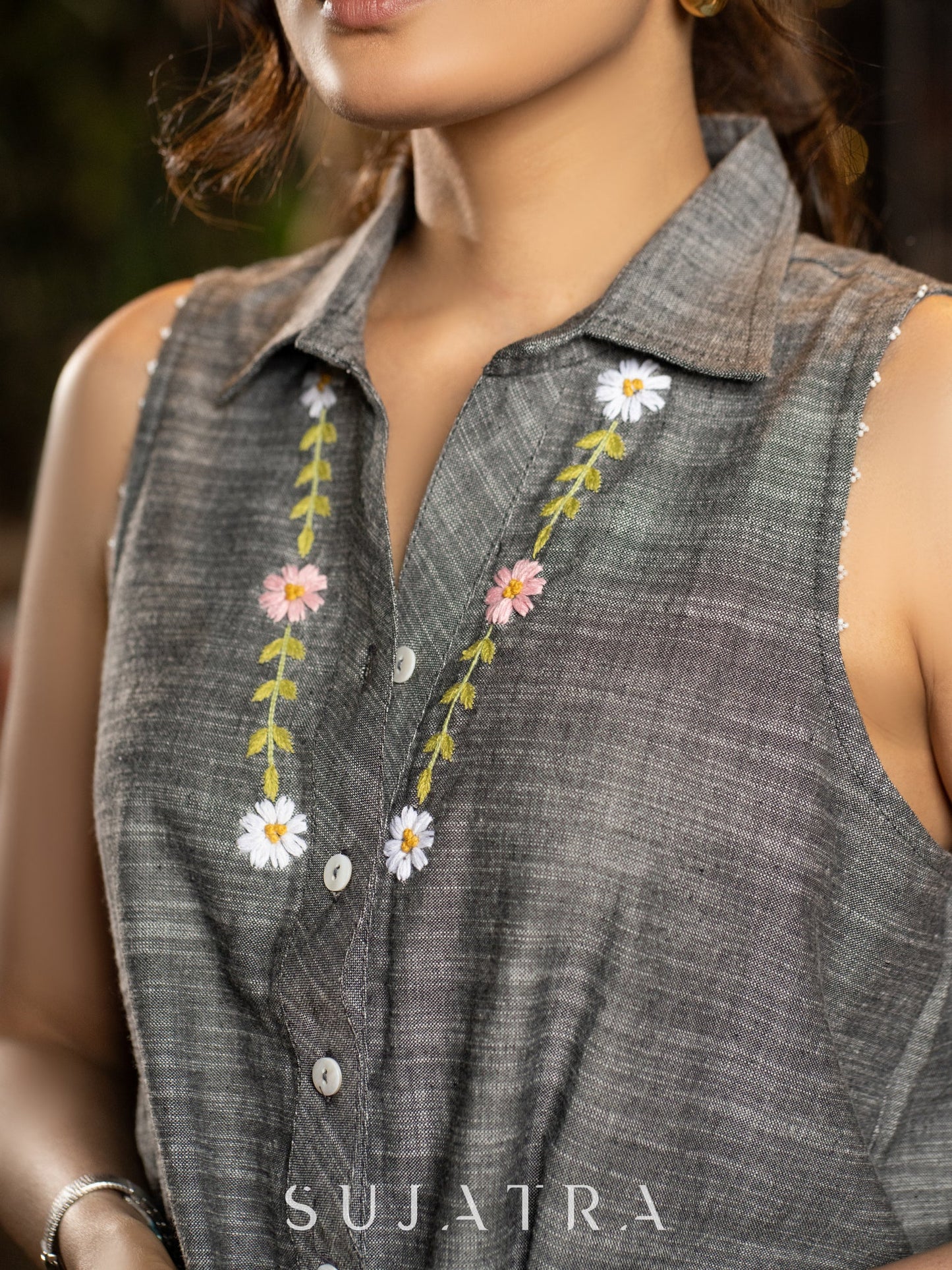 Graceful Sleeveless Grey Handloom Cotton Shirt with Hand-Embroidered Floral Accents