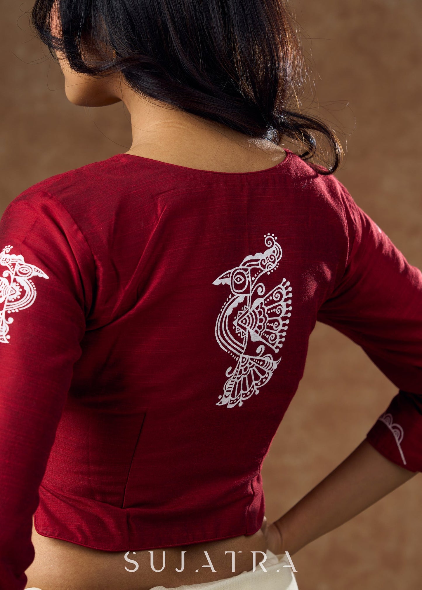 Cotton silk blouse with intricate hand-painted peacock motifs and elegant detailing