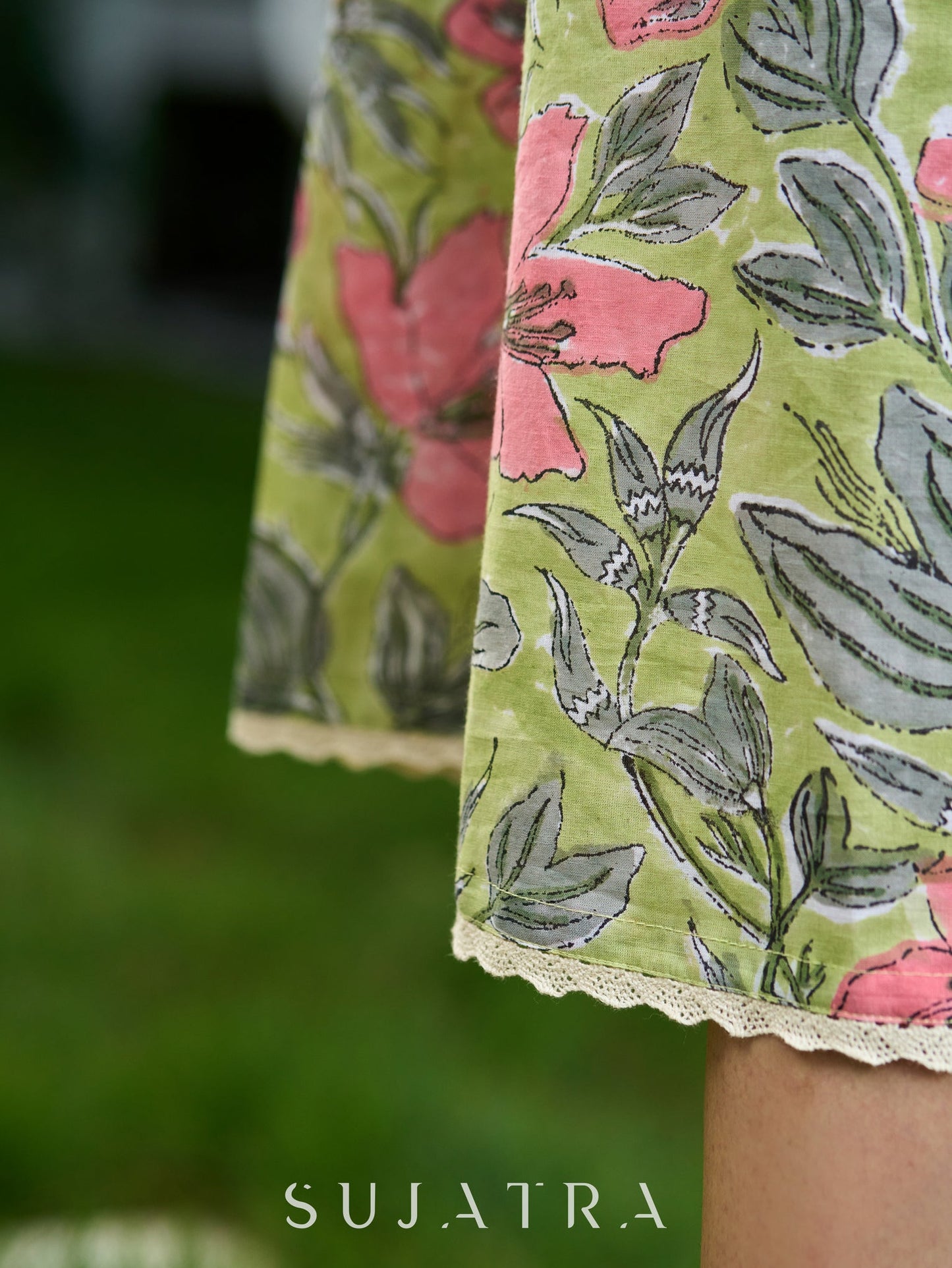Graceful Pista Green Dress with Contrasting Pink Touches and Lace Detailing