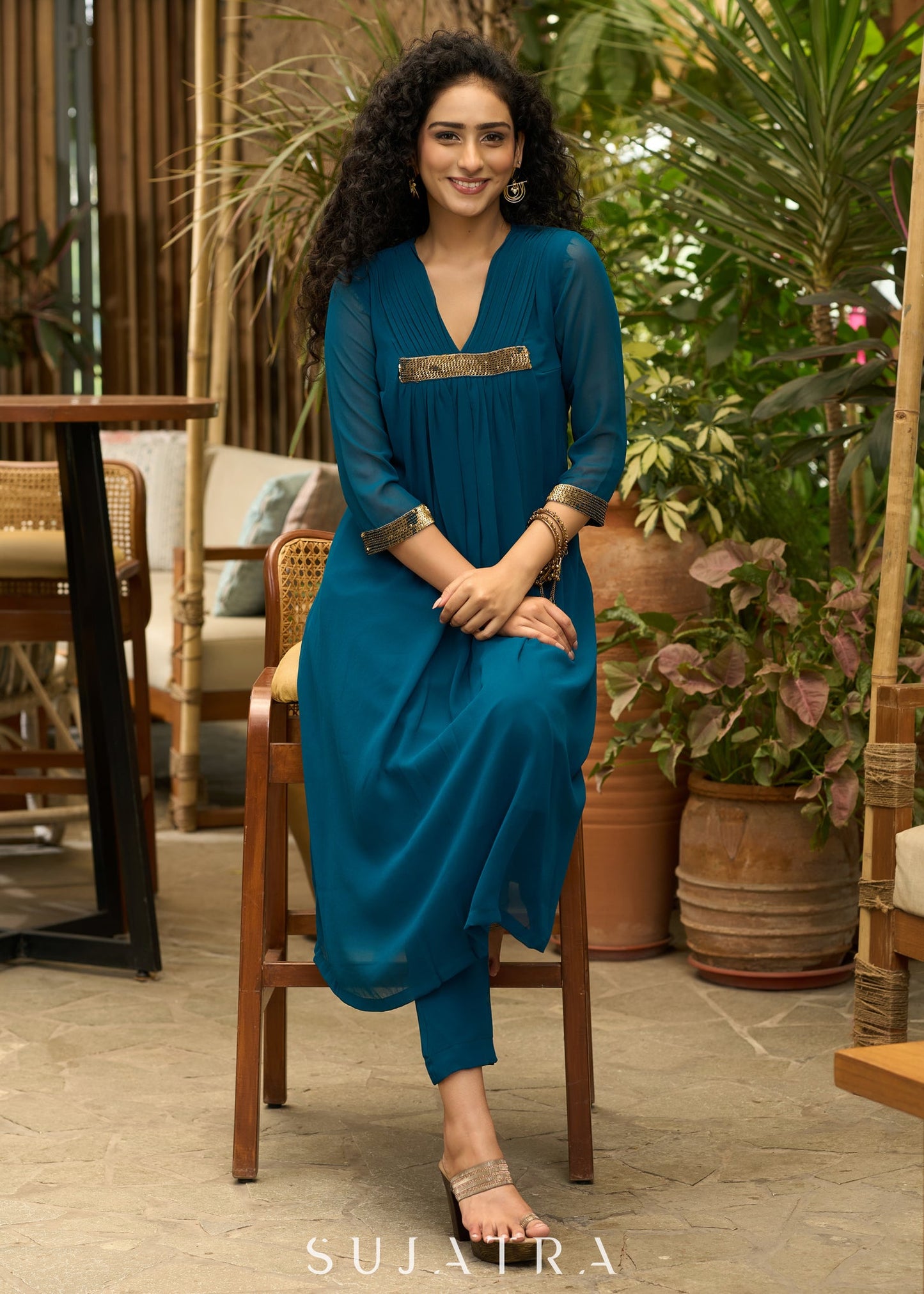 Exclusive turquoise georgette front pleated Co ord set with gold sequence work