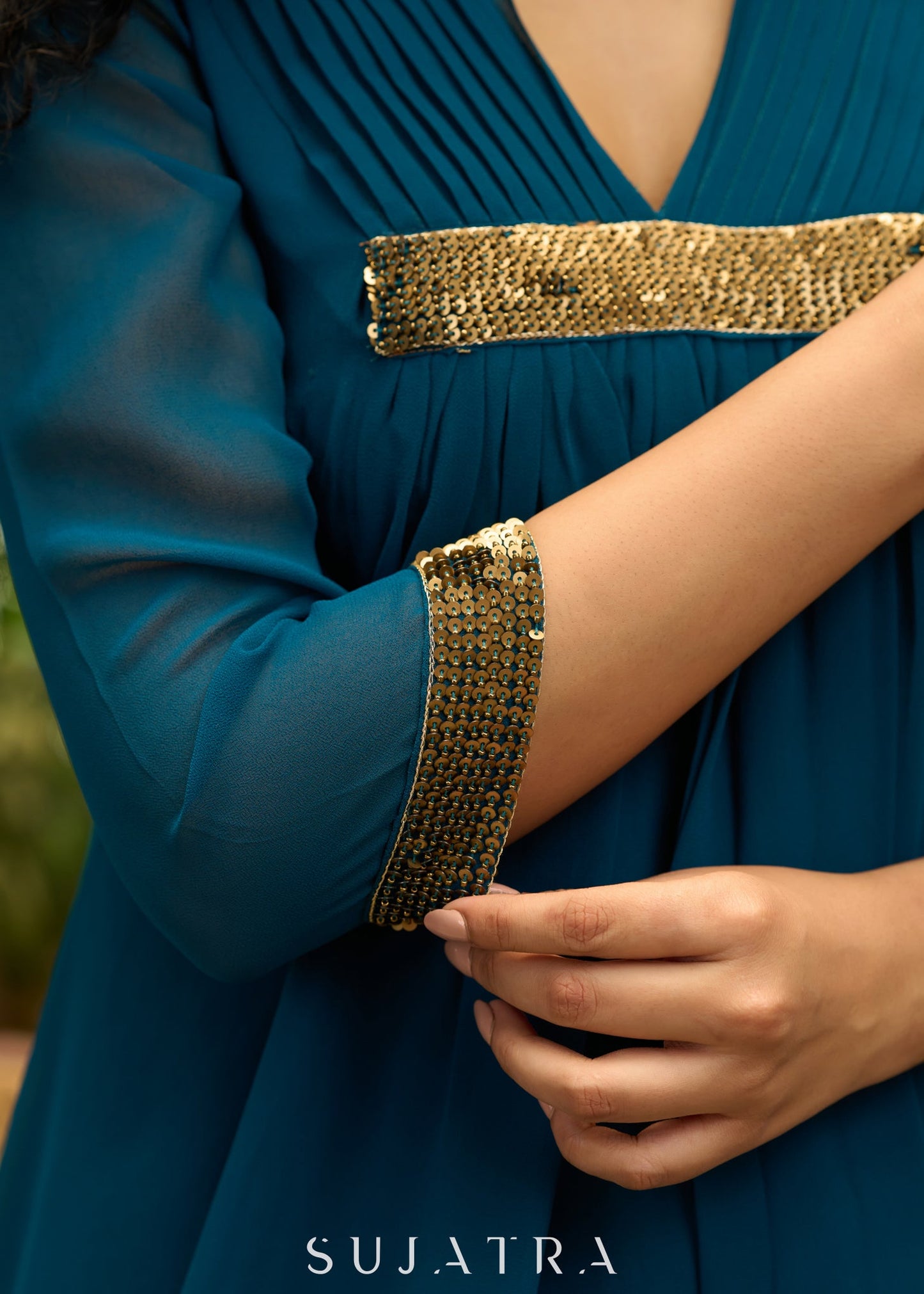 Exclusive turquoise georgette front pleated Co ord set with gold sequence work