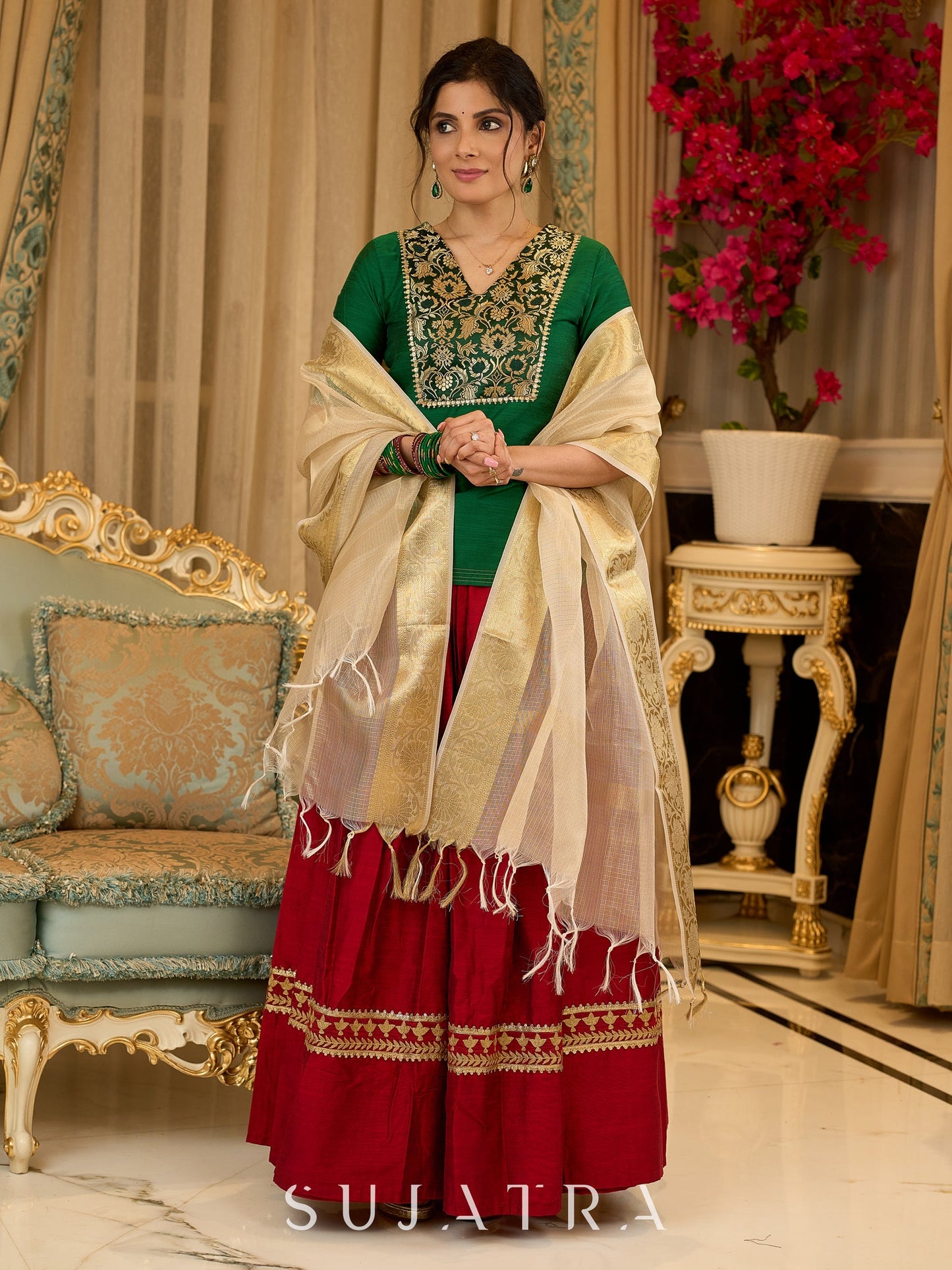 A traditional look featuring a red Cotton silk lehenga with a green Cotton silk choli with brocade yoke - Contrast dupatta optional