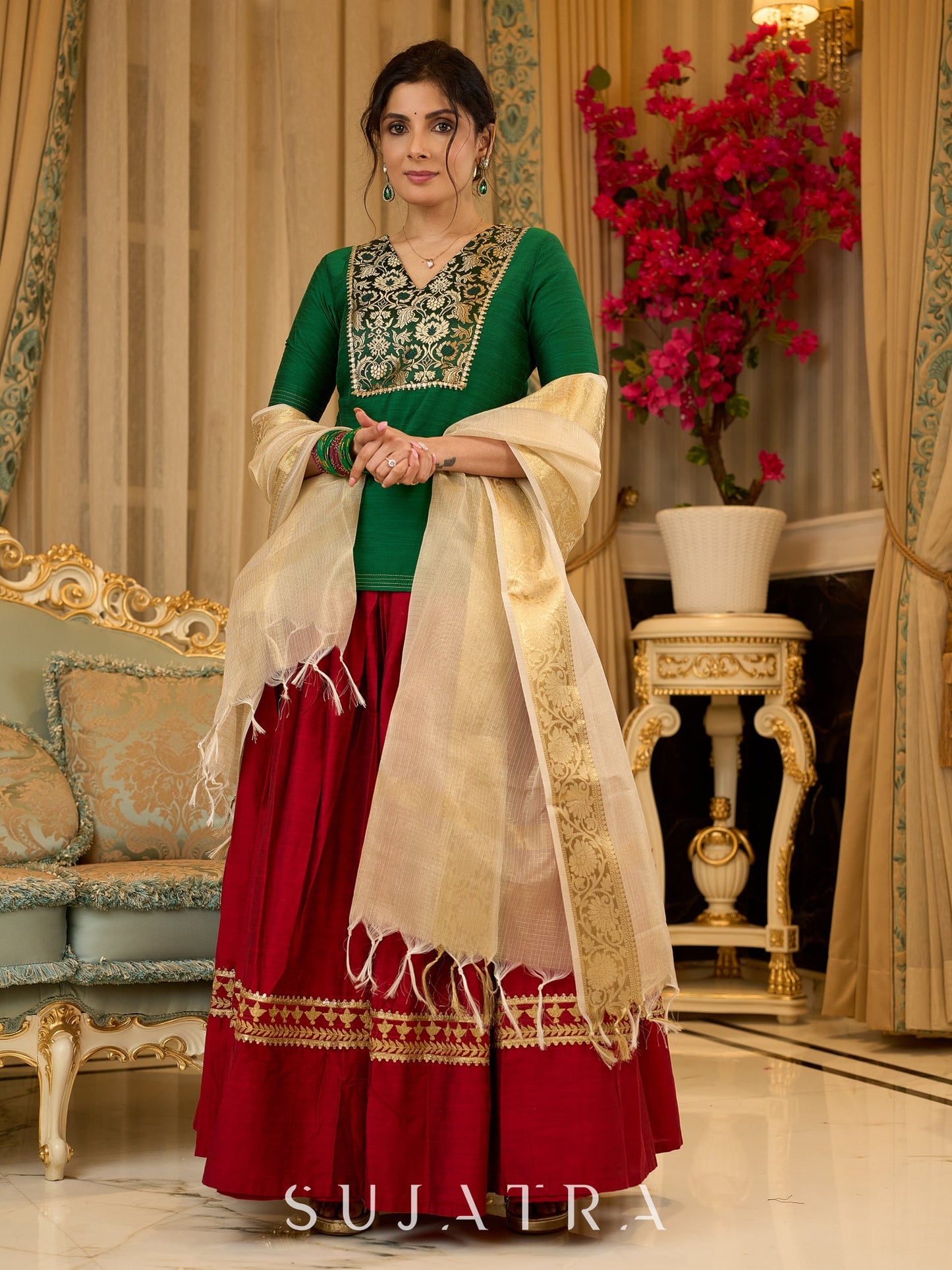 A traditional look featuring a red Cotton silk lehenga with a green Cotton silk choli with brocade yoke - Contrast dupatta optional