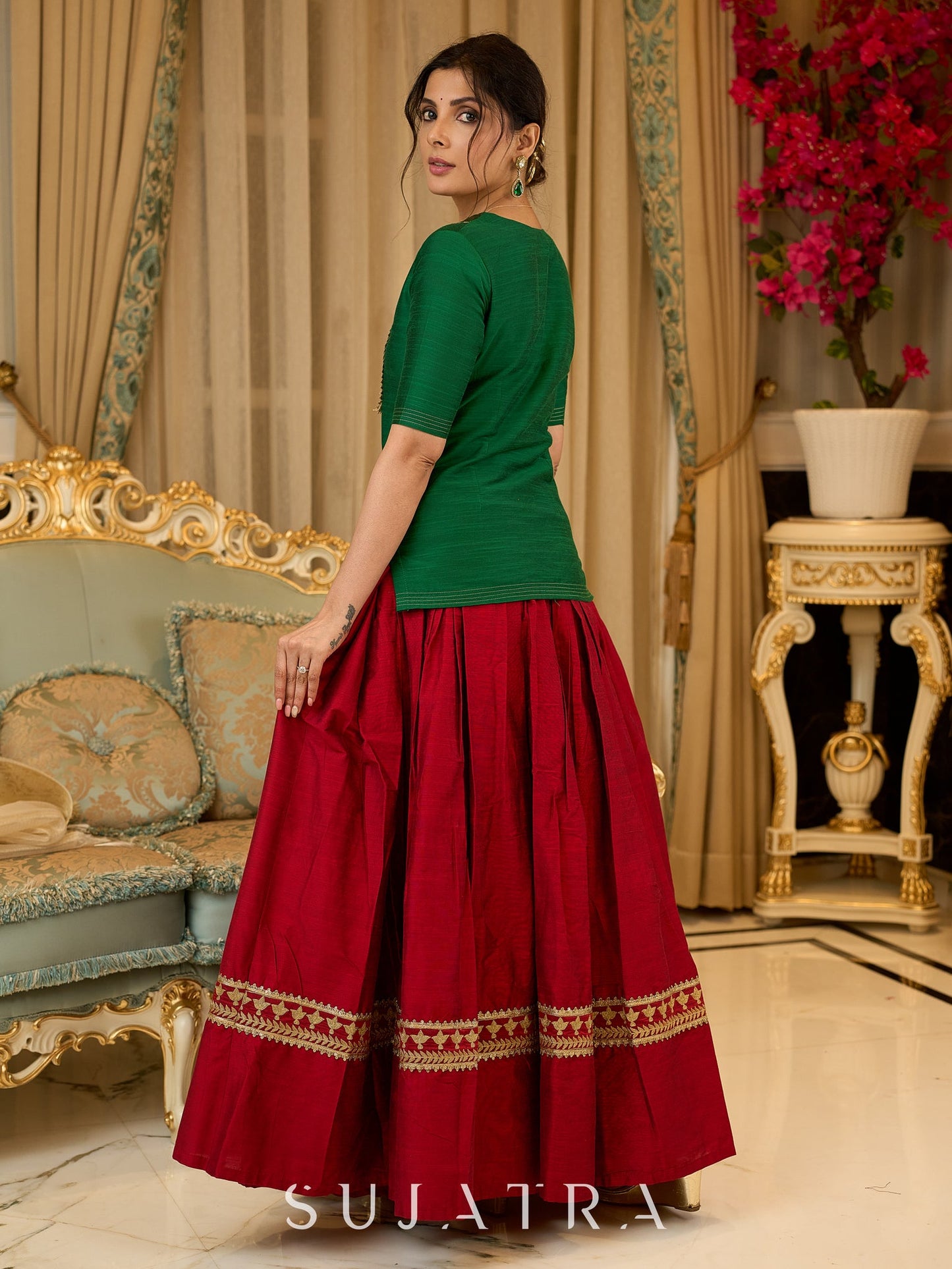 A traditional look featuring a red Cotton silk lehenga with a green Cotton silk choli with brocade yoke - Contrast dupatta optional