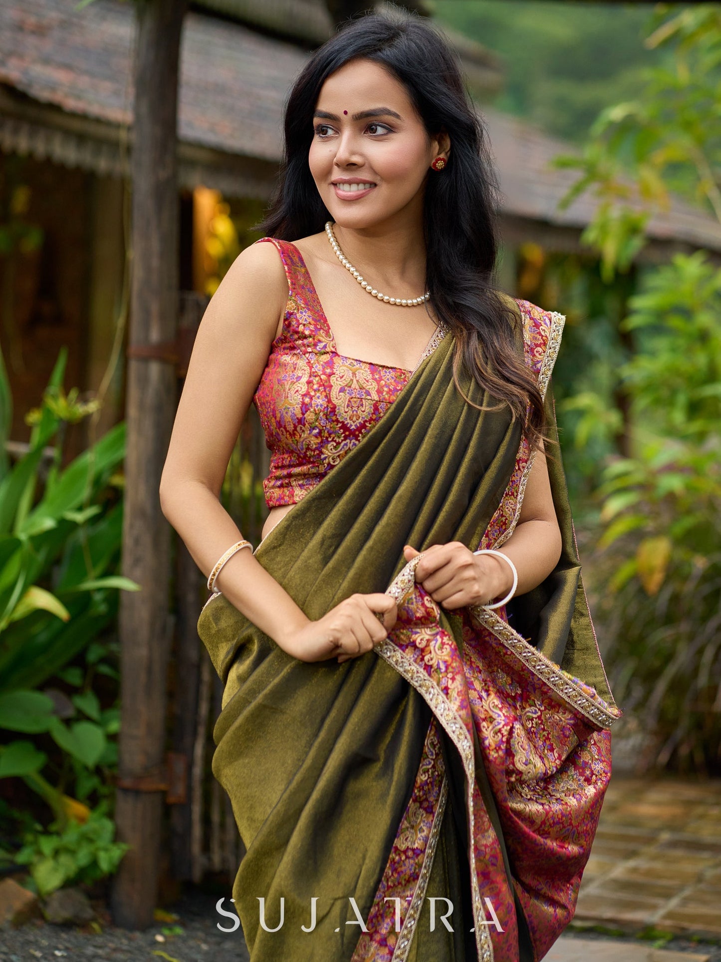 Regal olive tissue saree enhanced by intricate Banarasi brocade border