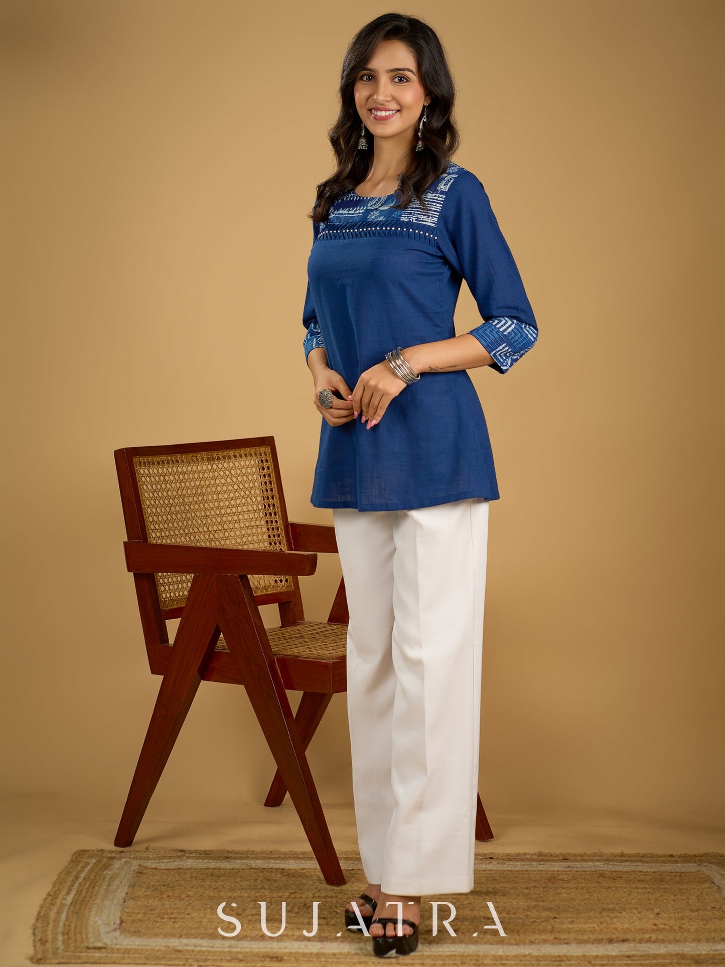 Classic indigo cotton patchwork top with subtle pearl highlights