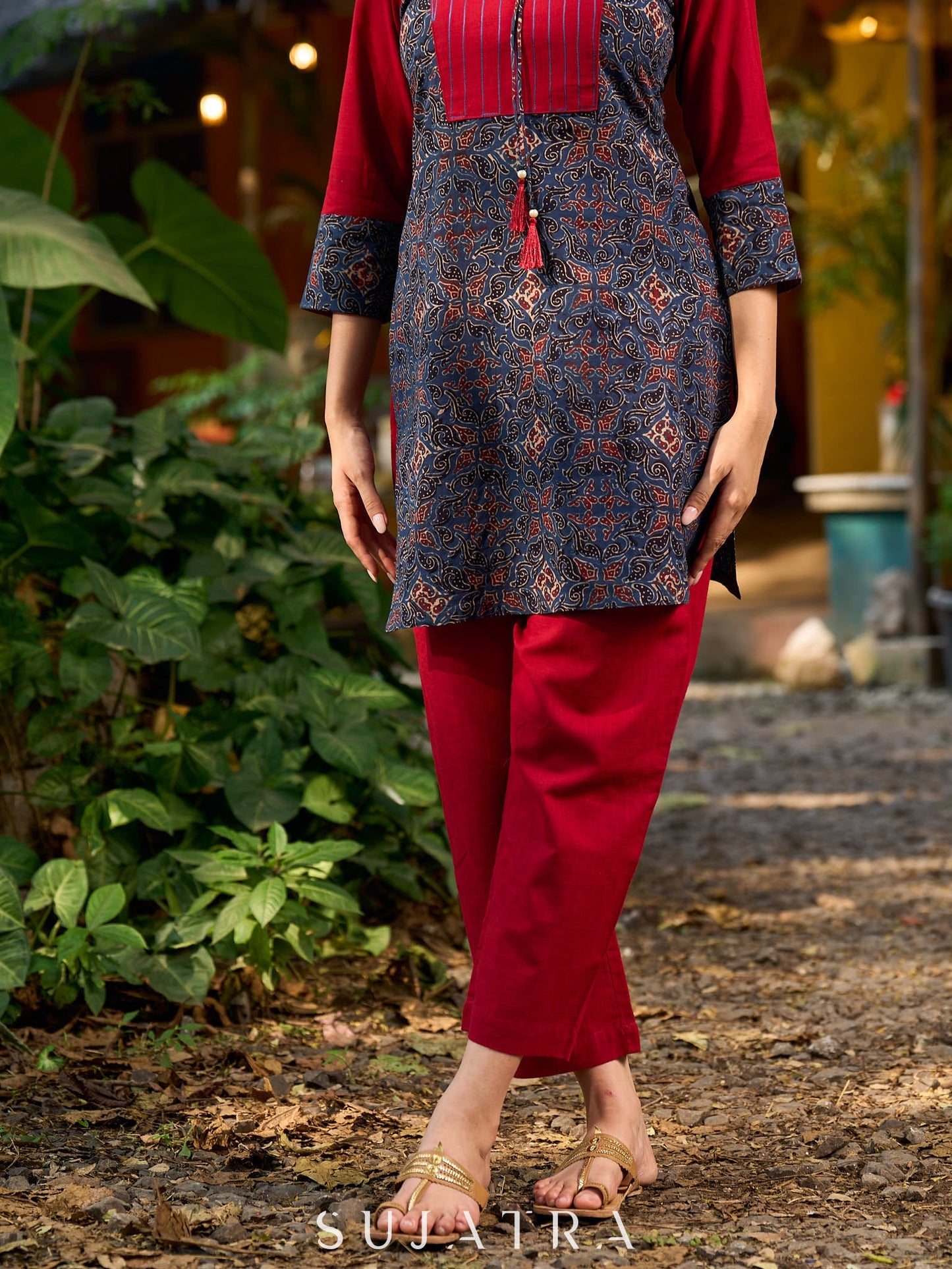 Blue Ajrakh short kurta with a handcrafted maroon patch.