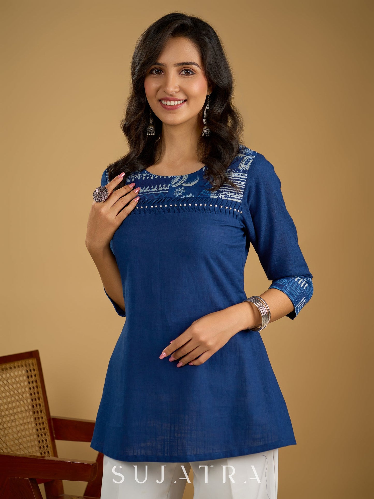 Classic indigo cotton patchwork top with subtle pearl highlights