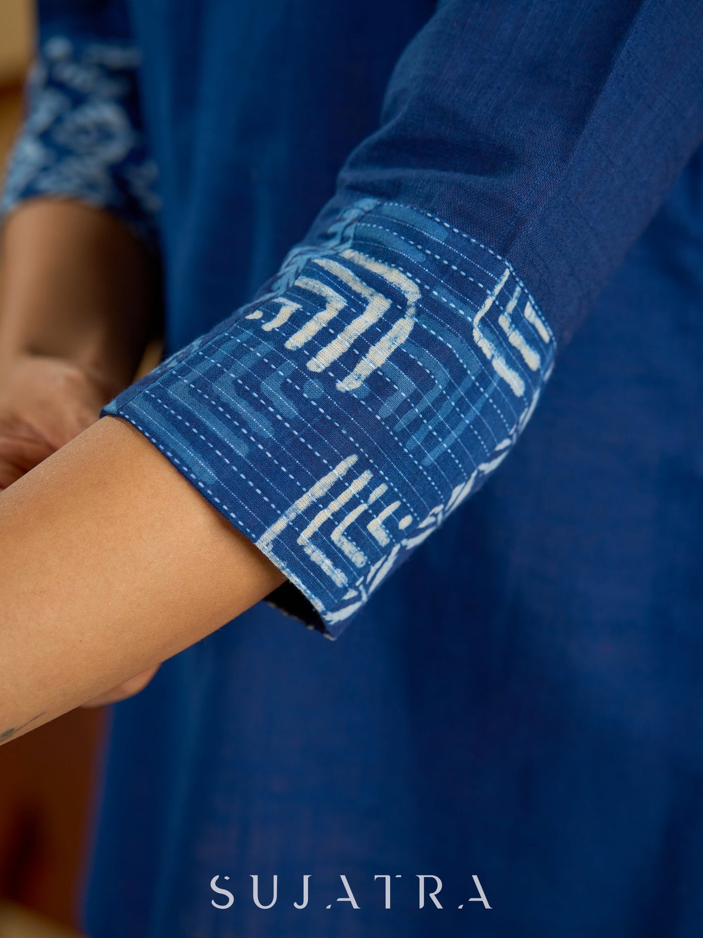 Classic indigo cotton patchwork top with subtle pearl highlights