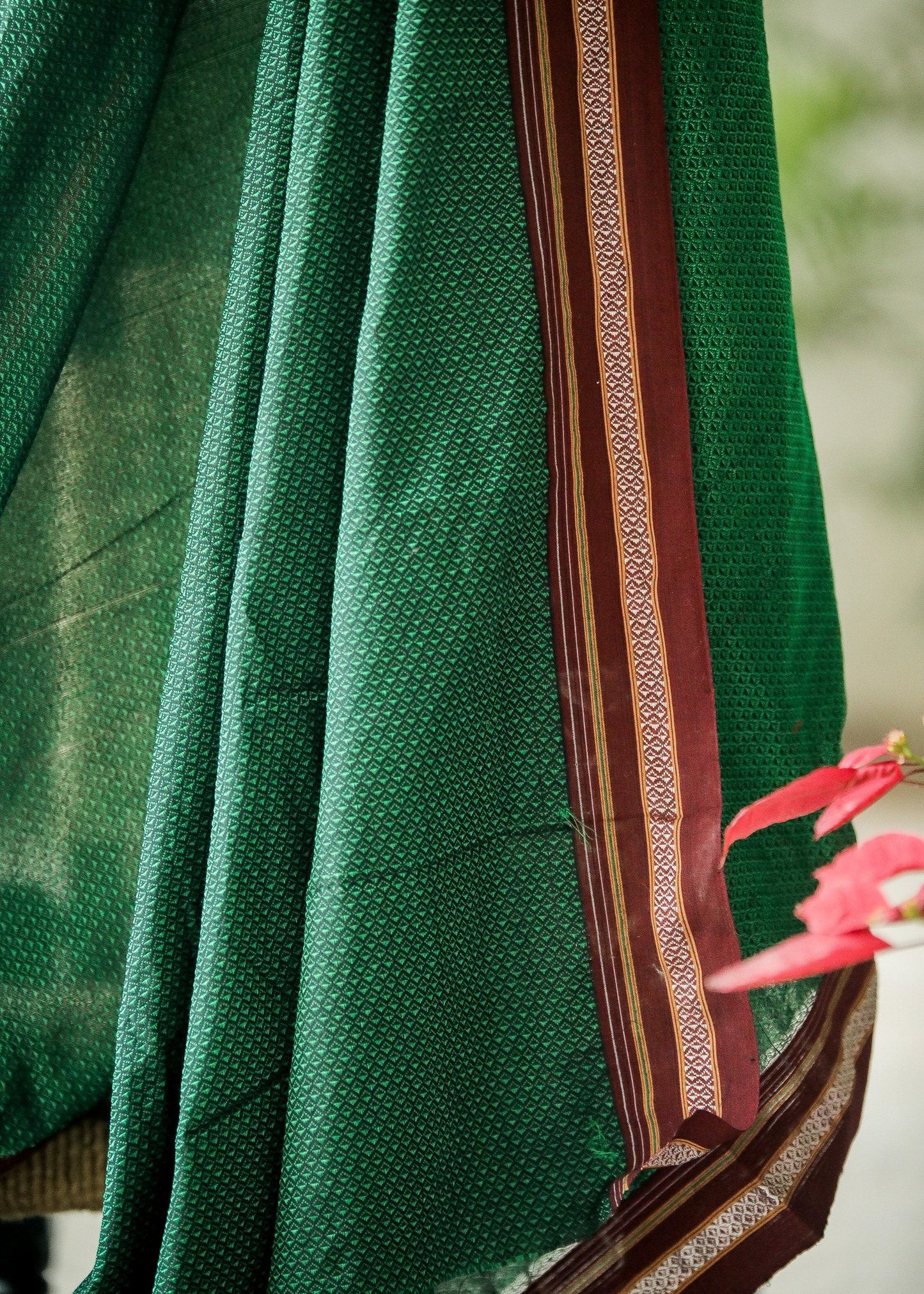 Beautiful Intricate Green Khun Fabric with contrast border and subtle Sheen