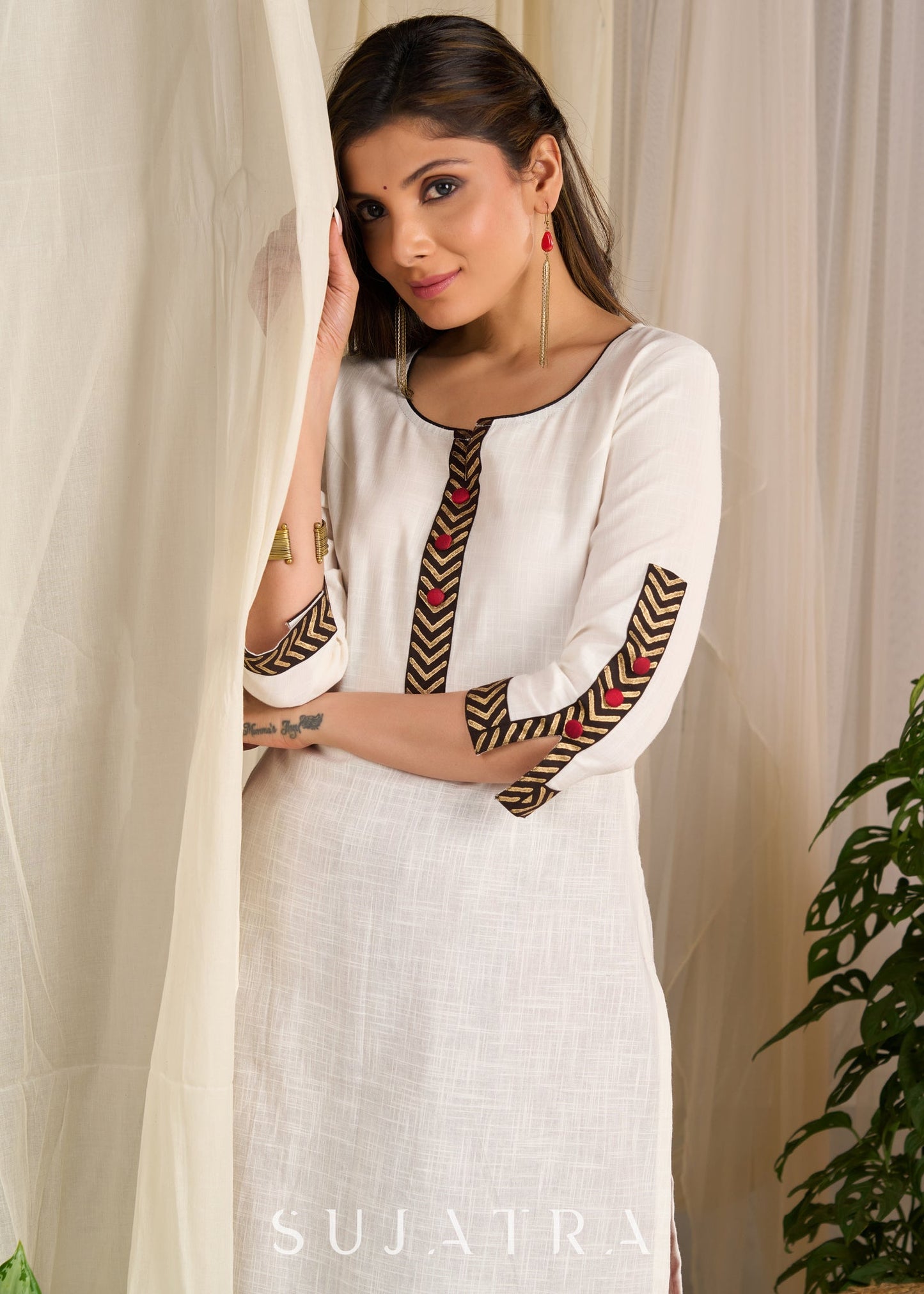 Graceful white cotton kurta with bold chevron block prints and intricate detailing