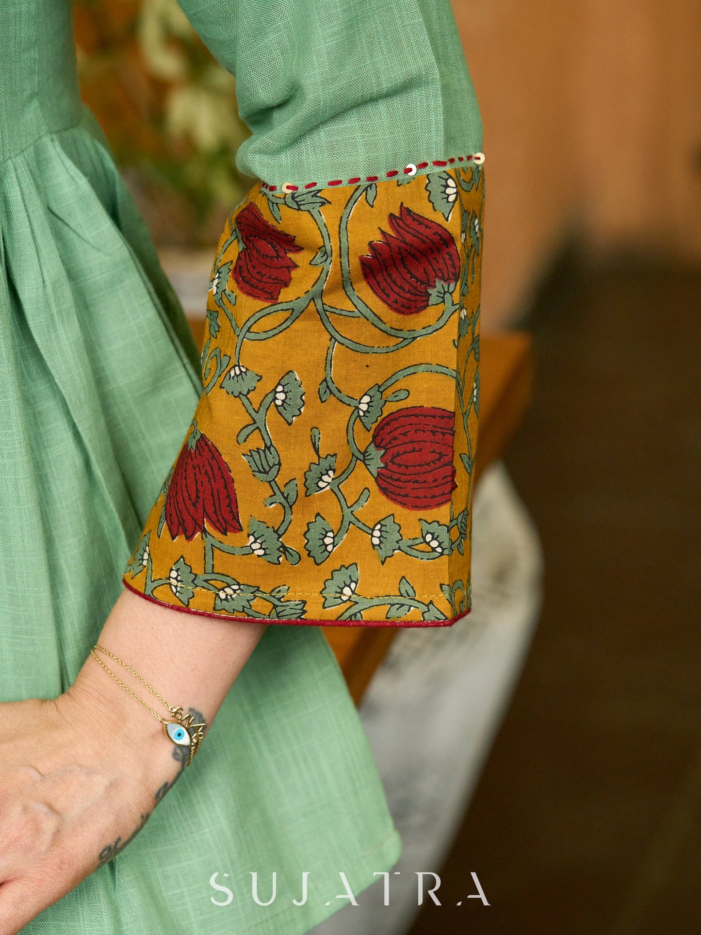Green Artisan Cotton Top with Contrast Mustard Floral Printed Sleeves and Delicate Embellishments and Hand Embroidered Kantha