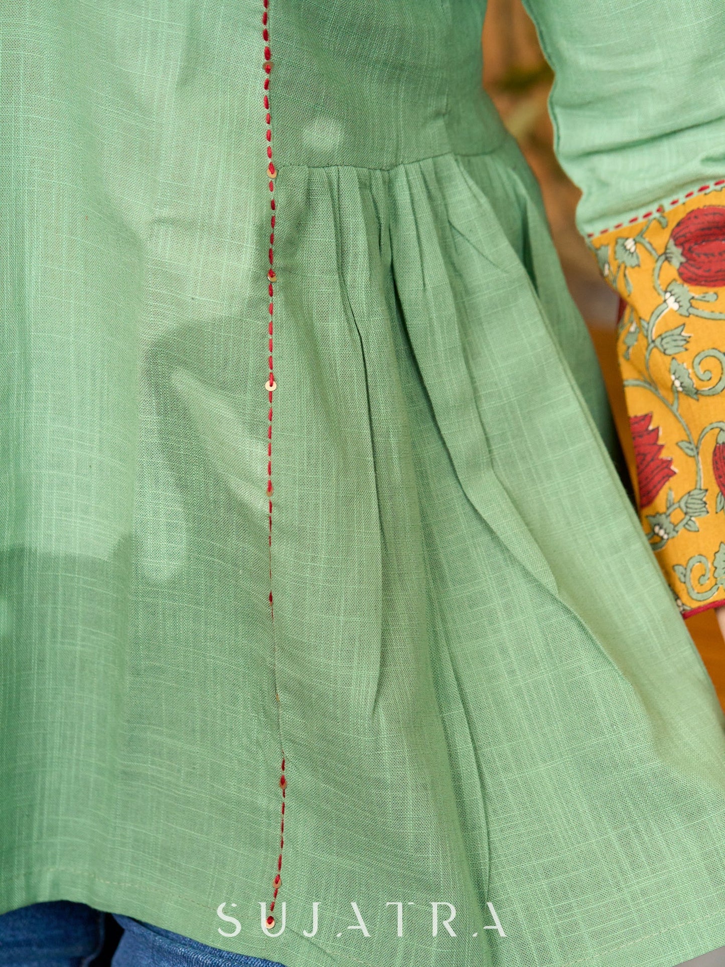 Green Artisan Cotton Top with Contrast Mustard Floral Printed Sleeves and Delicate Embellishments and Hand Embroidered Kantha