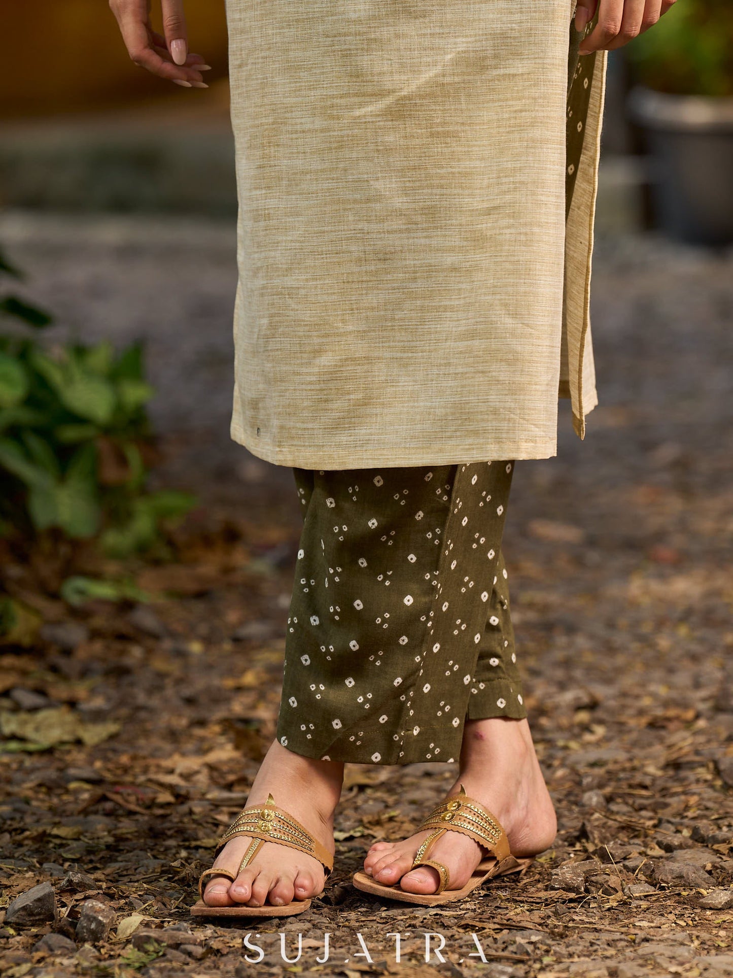 timeless cream kurta enhanced with handcrafted olive bandhani elements.