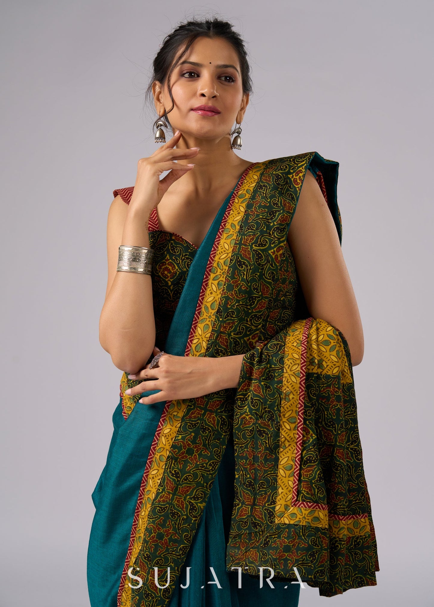 Exclusive green cotton saree with Ajrakh patchwork border