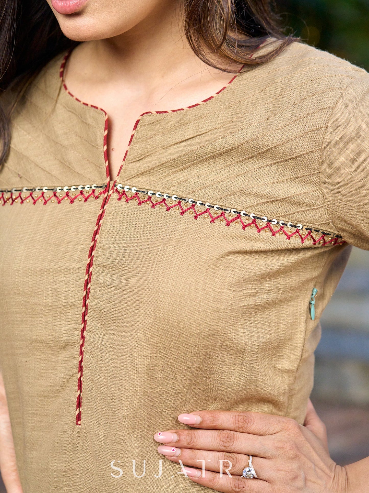 Hand-embroidered dark beige kurta featuring elegant pintuck detailing -pant optional