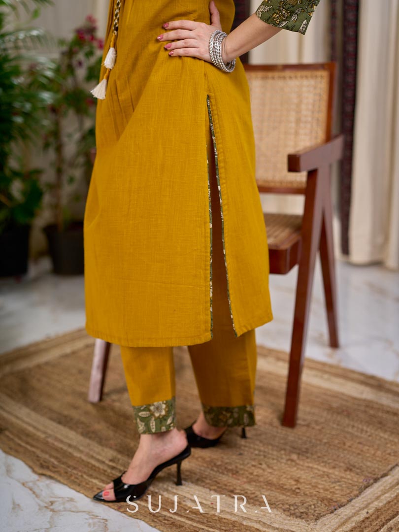 Vibrant Mustard Cotton Kurta with Olive Floral Print Yoke and Statement Tassel Embellishment