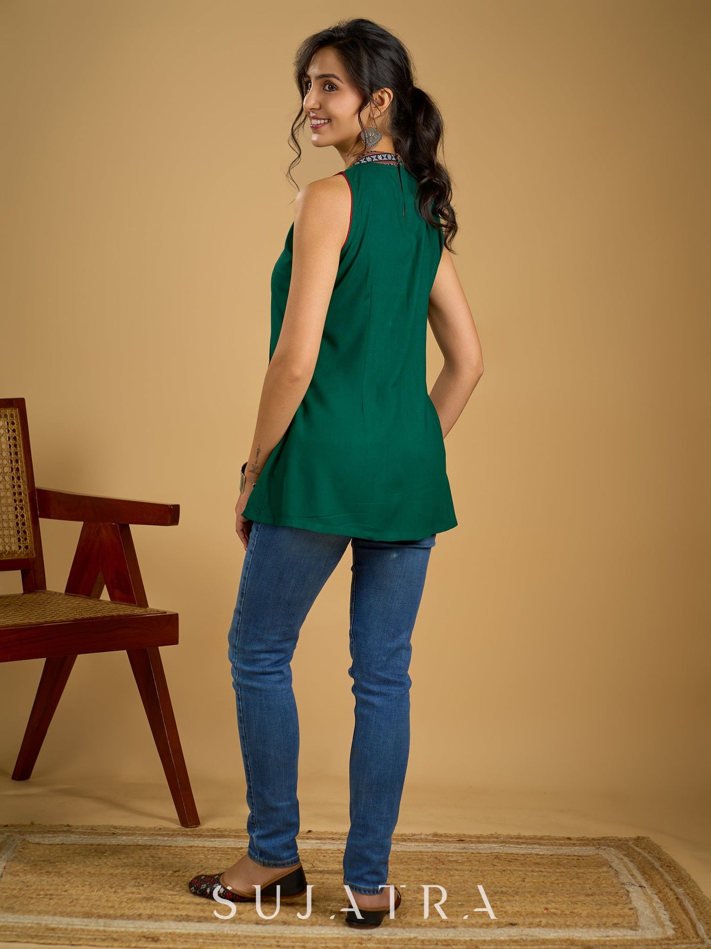 Elegant rayon green sleeveless top with ikat accents.