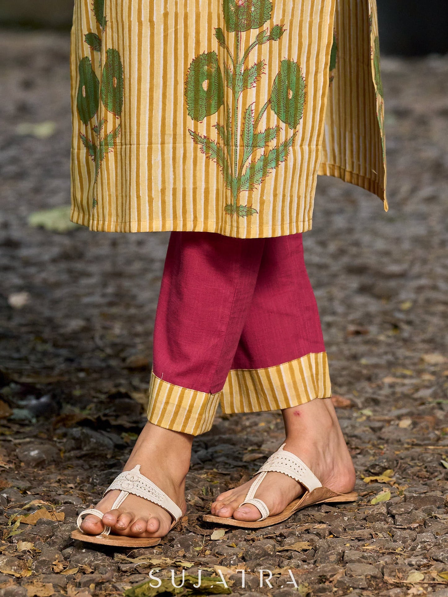 Handcrafted mustard kurta with stripe–floral print and magenta accents.