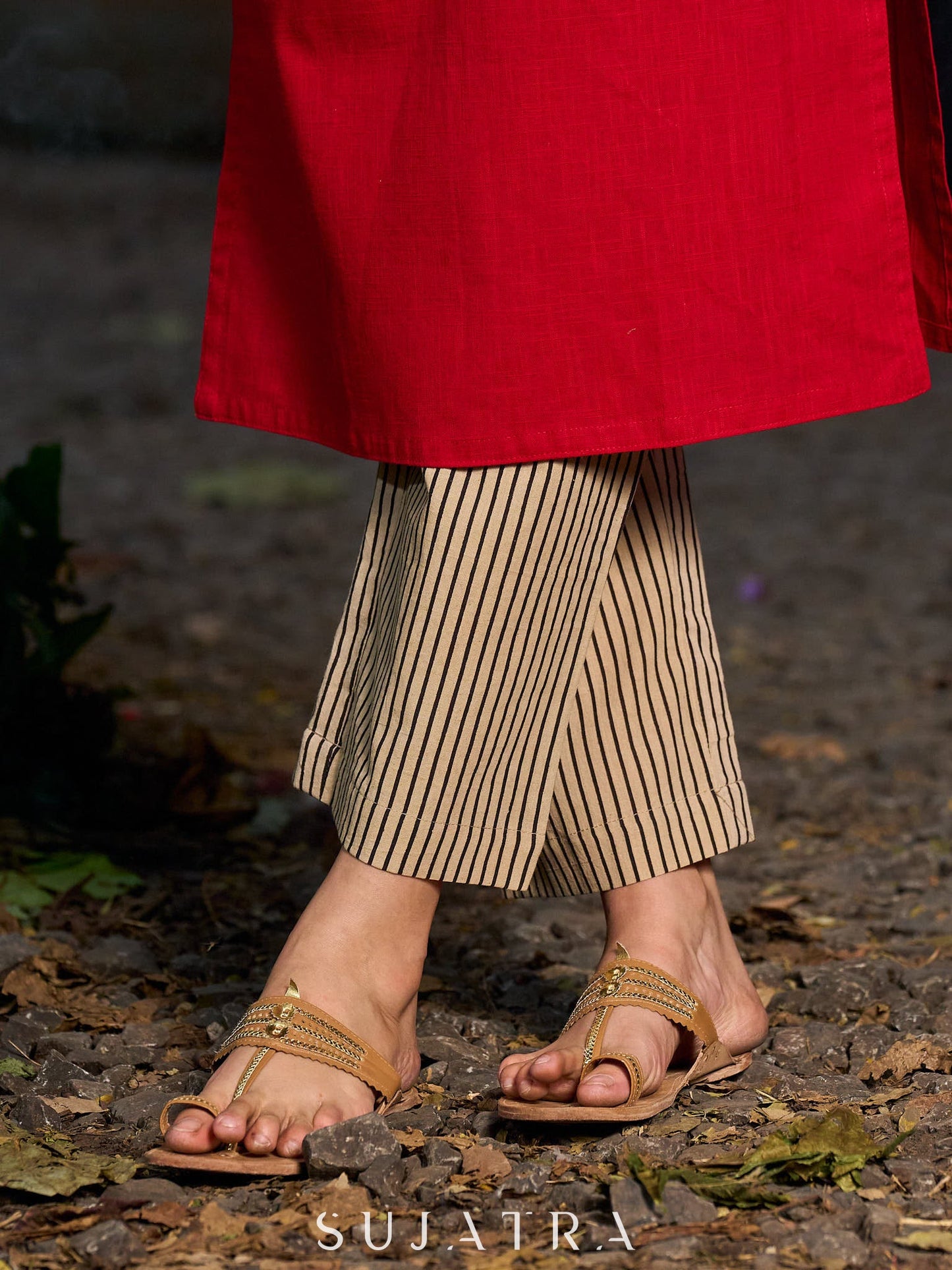 Elegant red kurta featuring a V-shaped striped neck panel