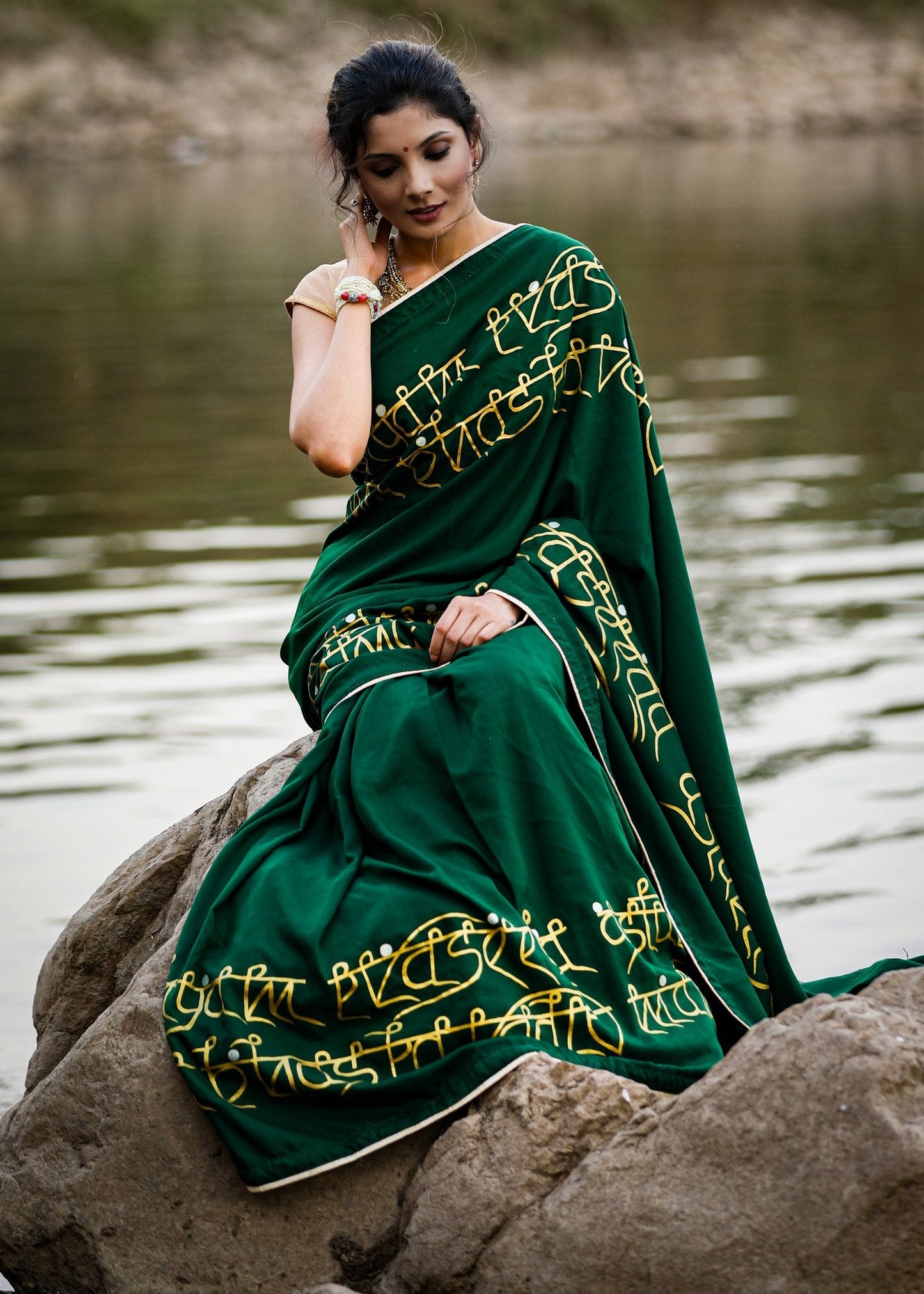 Exclusive forest green hand painted crepe satin saree