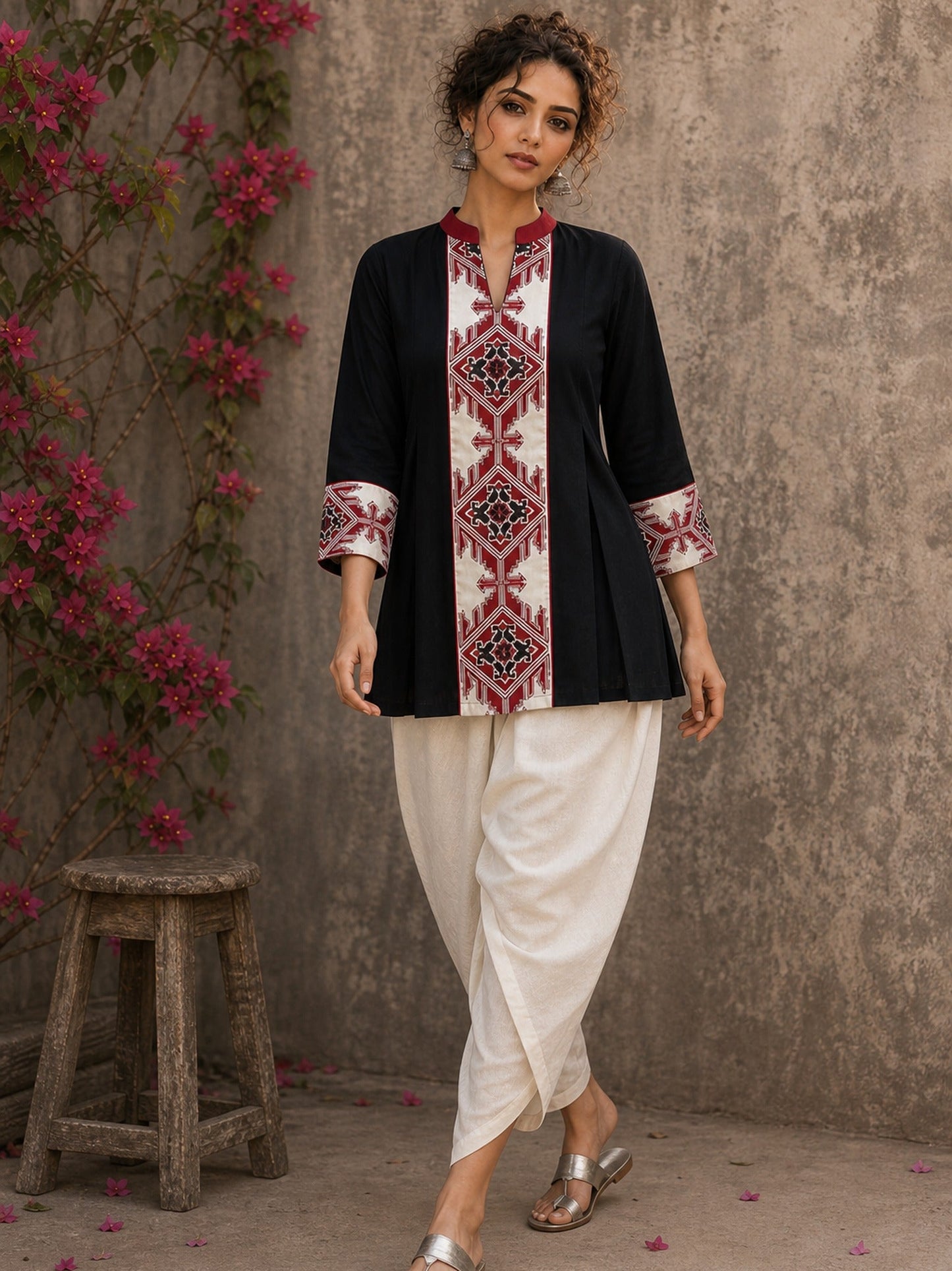 Heritage-inspired black top showcasing handcrafted block print panels, elegant maroon trims, and timeless artistry for versatile modern styling.