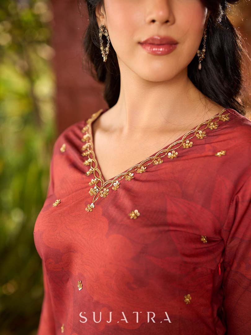 Classic deep rustic maroon kurta with detailed hand embroidery, statement olive and cream Pichwai artwork, and rich gold highlights