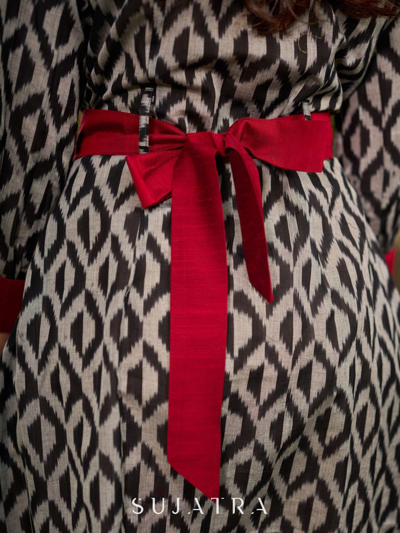 Elegant black grey mercerised Ikat shirt dress featuring a soft square neck, subtle maroon detailing, and a waist belt for a gently flowing silhouette.