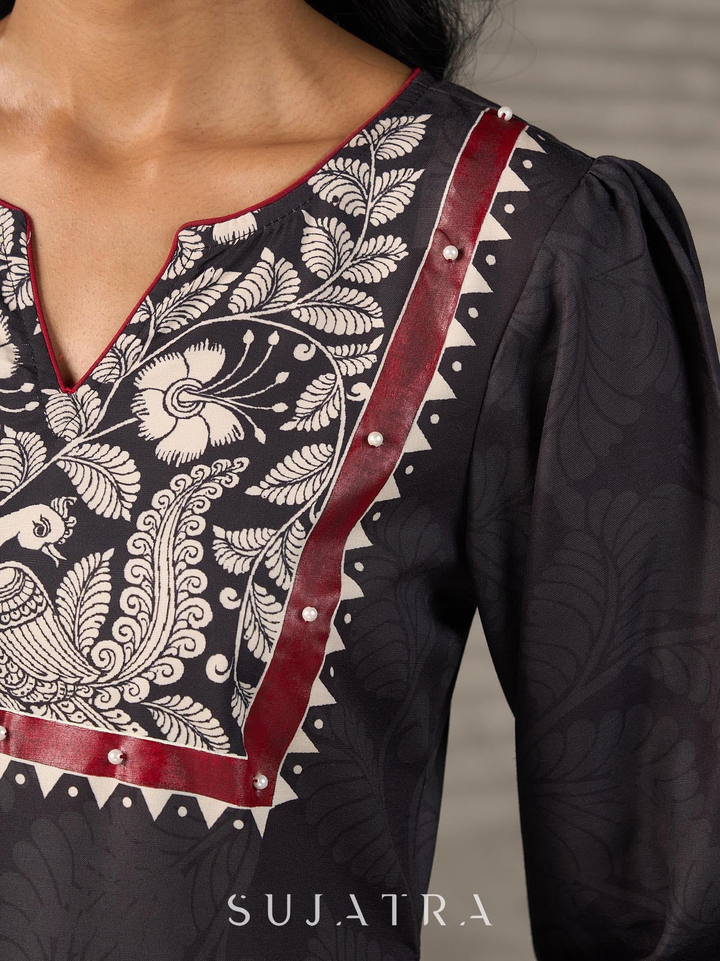Black Kalamkari-inspired printed dress with maroon accents and pearl embellishments