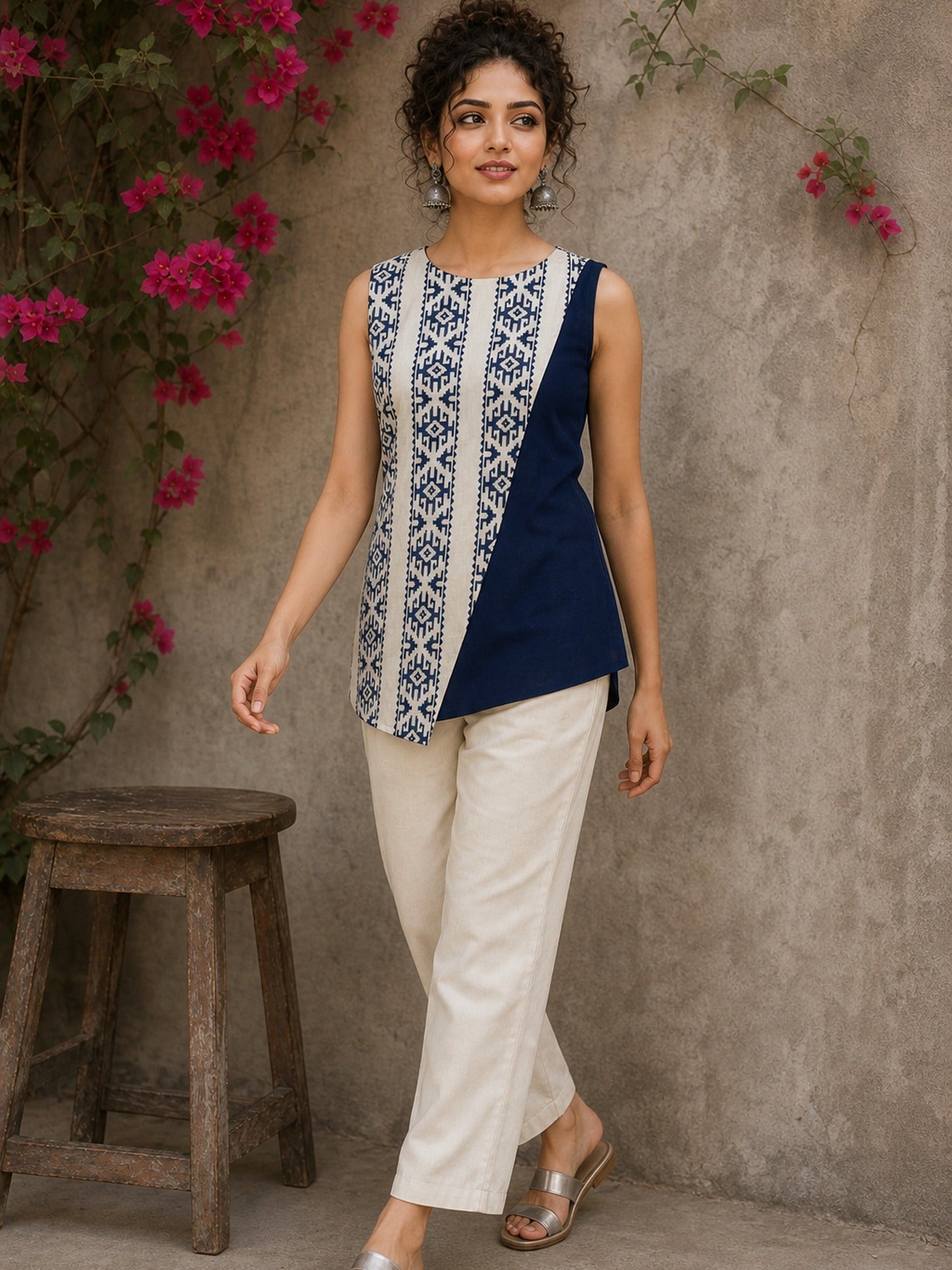 Contemporary off white and navy hand block print top featuring striking geometric motifs, an asymmetric layered silhouette, and effortless elegance