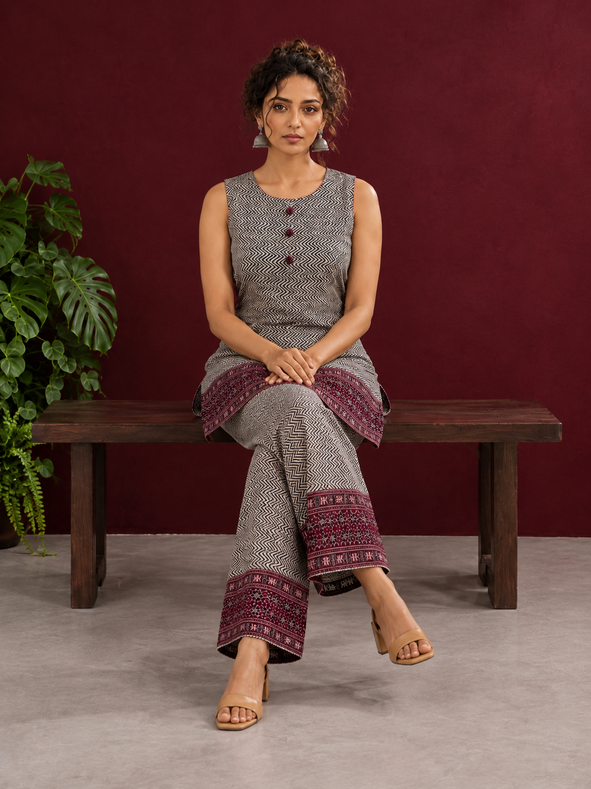 Classic Beige & Black Ajrakh Print Co-Ord Set with Maroon Floral Border Detail — seated