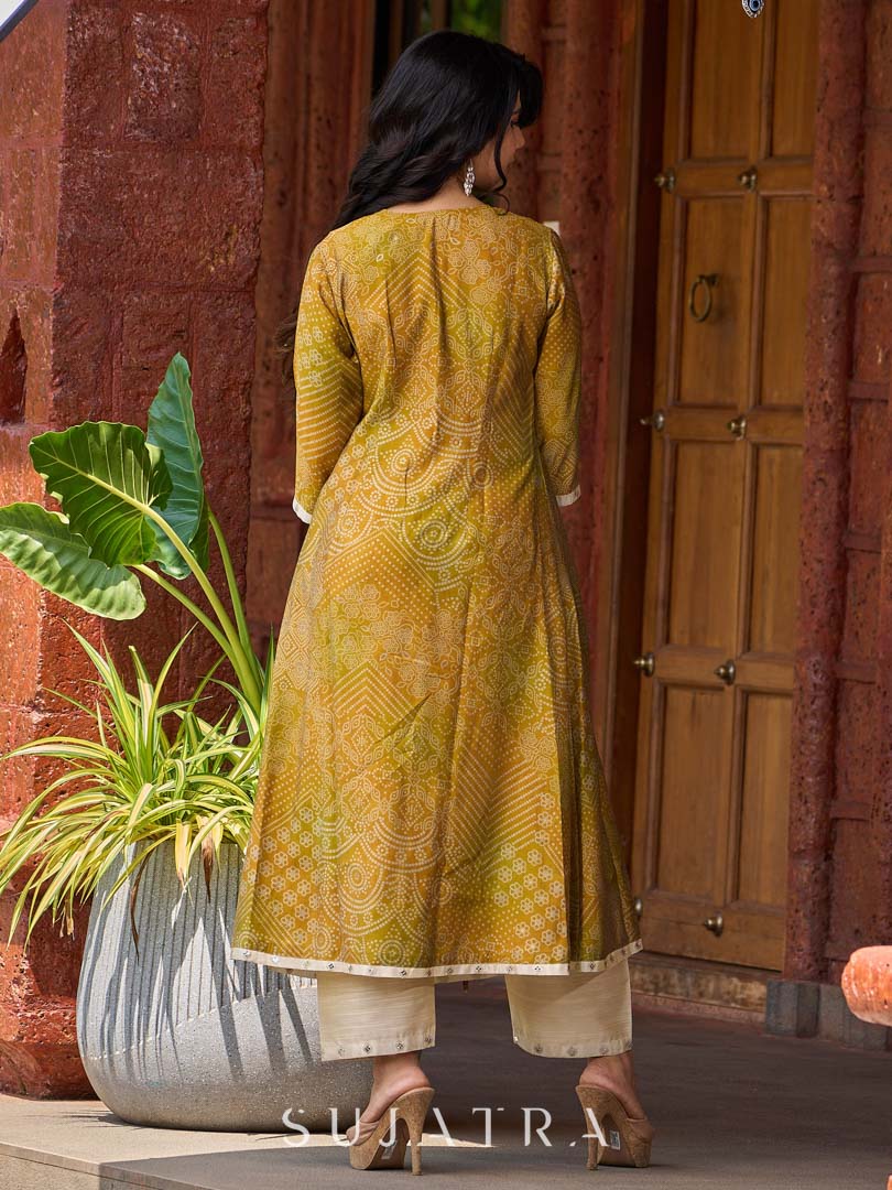Exquisite yellow Bandhani printed kurta with a delicate off-white tissue overlay and refined accents.