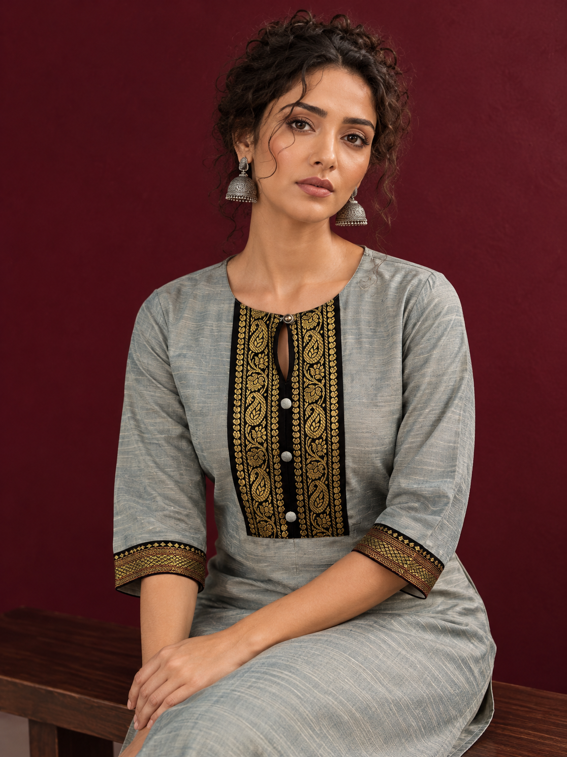 Elegant Sage Green Silk Kurta with Black zari Paisley Yoke & Contrast Sleeve Cuffs — seated detail
