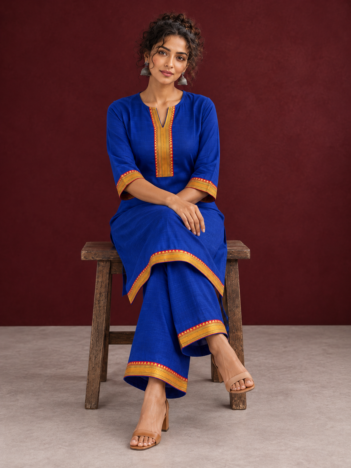Elegant Royal Blue Cotton Silk Kurta with Contrast Mustard & Red Traditional Border On Neckline and Sleeve Cuffs — seated