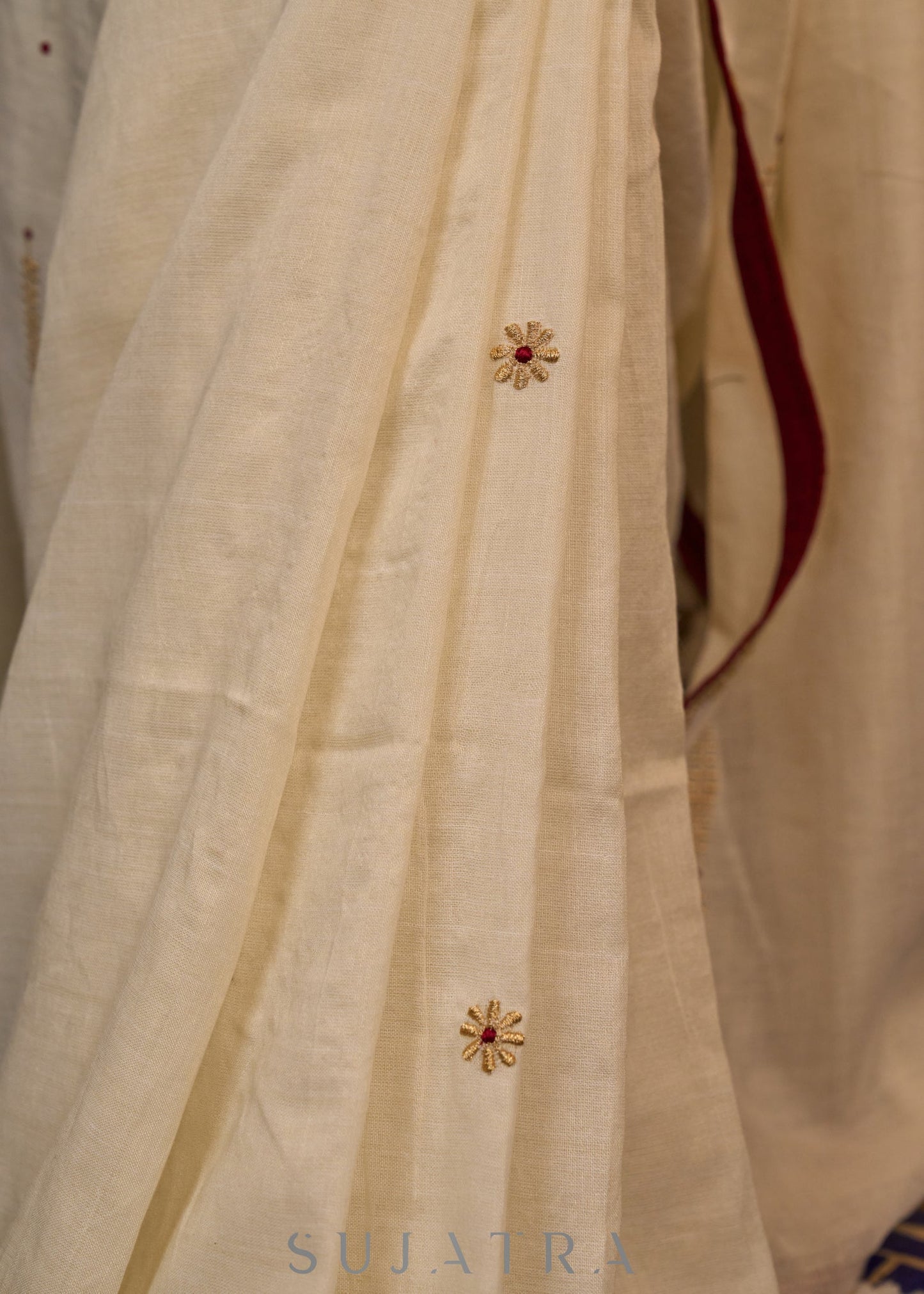 Graceful ivory cotton saree highlighted with beautiful overall intricate embroidery