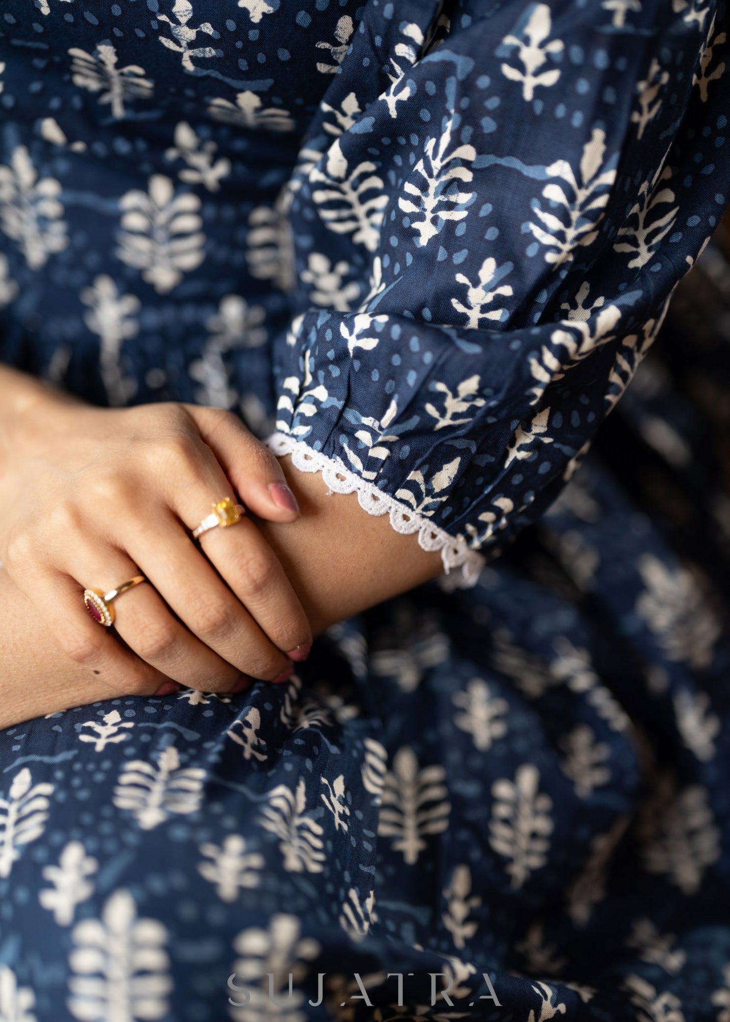 Trendy navy blue floral printed rayon gathered dress highlighted with beautiful lace