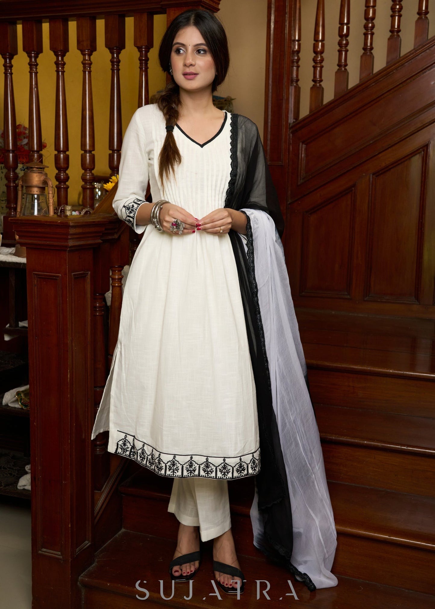 Elegant off-white cotton kurta adorned with intricate embroidery complimeted by matching pants - Dupatta Optional