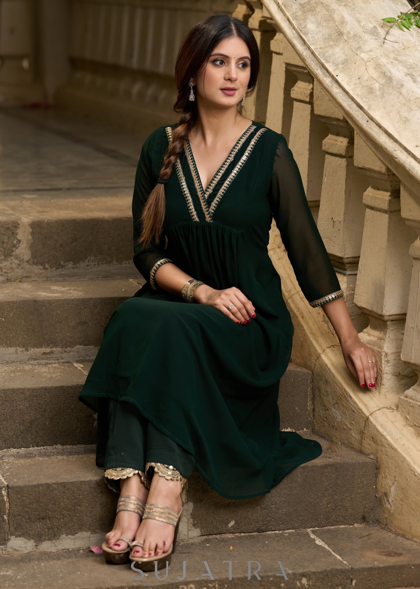 Elegance redefined in this captivating green georgette lace kurta and pant ensemble