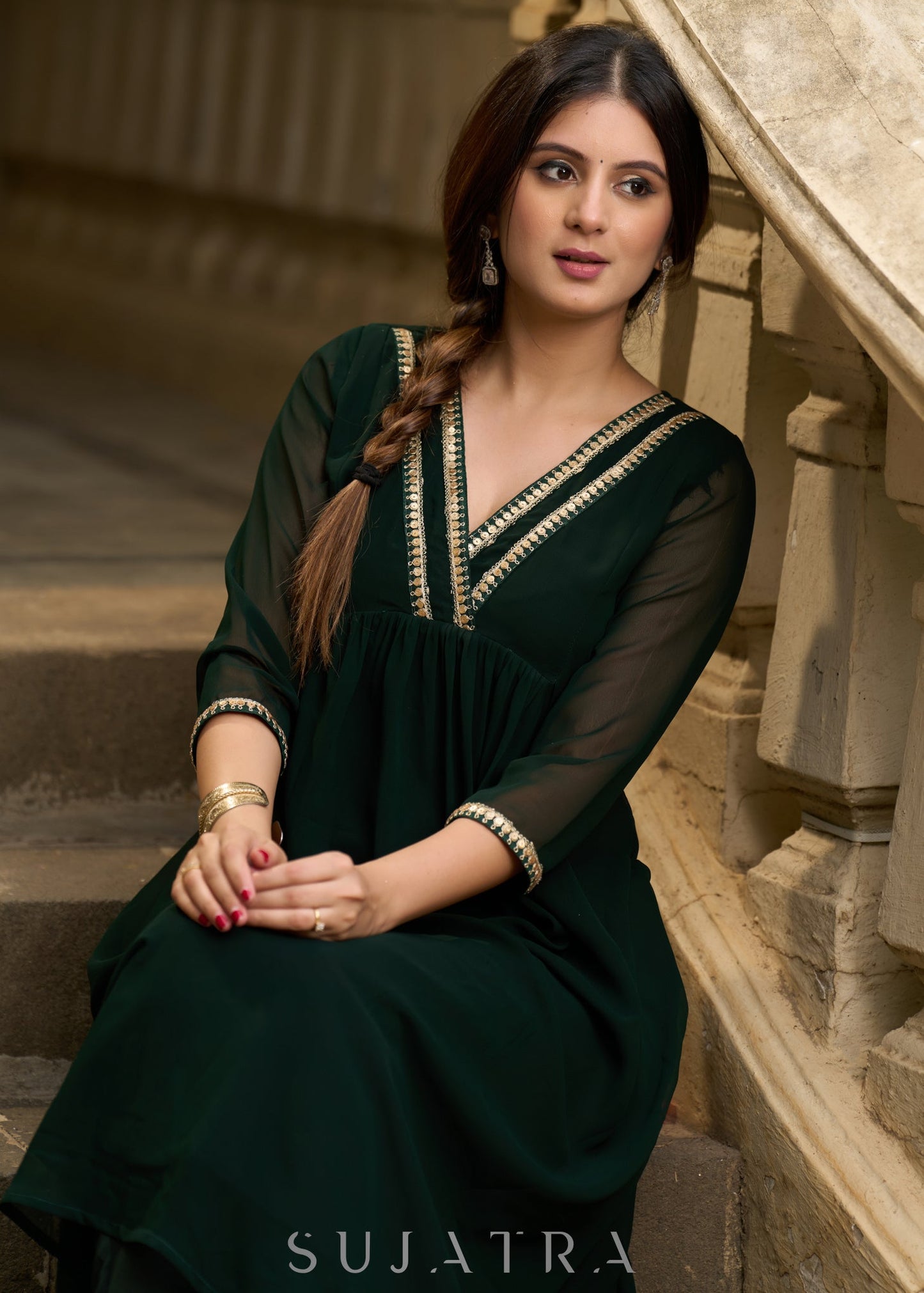 Elegance redefined in this captivating green georgette lace kurta and pant ensemble